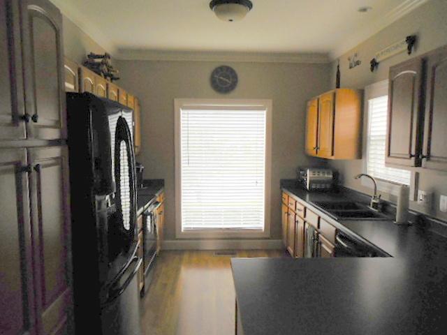 414 Conquest Road Murfreesboro, TN 37128 - Photo 5 of 18 Kitchen with Hardwood Flooring, Smooth Top Stove, Microwave, Dishwasher and Area for Barstools