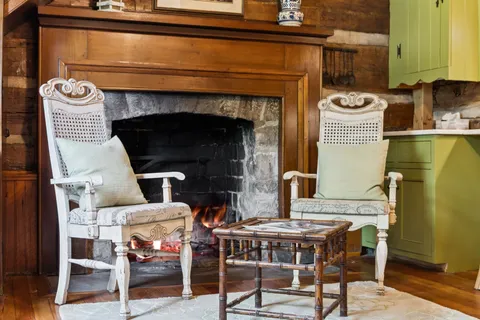 a room with wooden floor and windows
