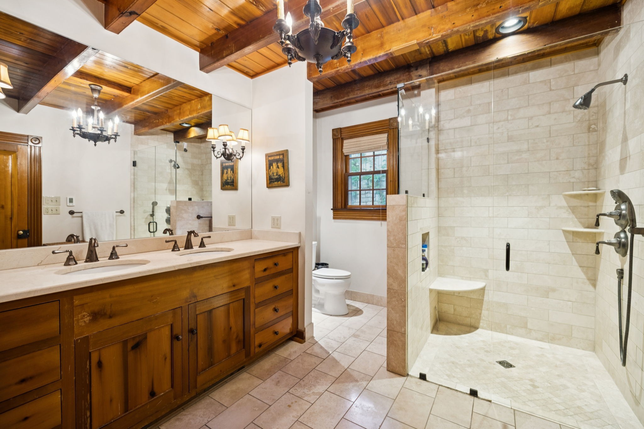 3507 Wimbledon Road Nashville, TN 37215 - Photo 26 of 50 a spacious bathroom with a shower sink and mirror