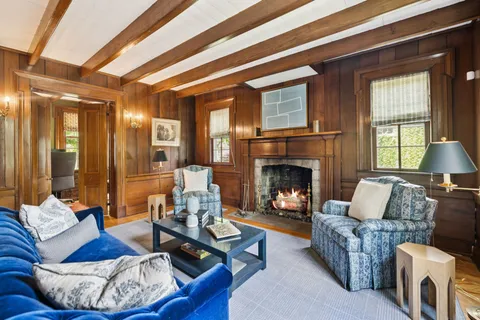 a bedroom with a bed and a fireplace