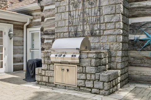 a front view of a building with couple of furniture