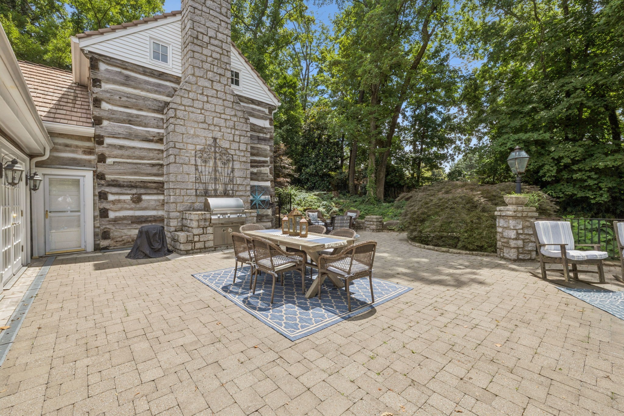 3507 Wimbledon Road Nashville, TN 37215 - Photo 40 of 50 a patio with table and chairs and potted plants