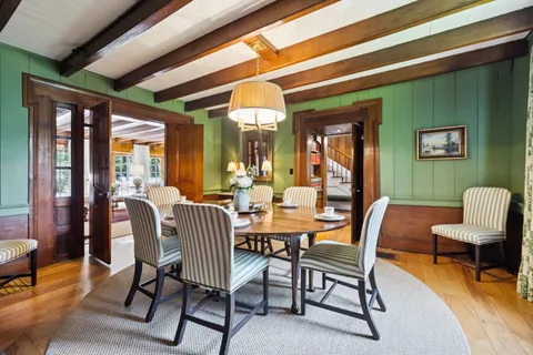 a view of a bedroom with furniture and a window