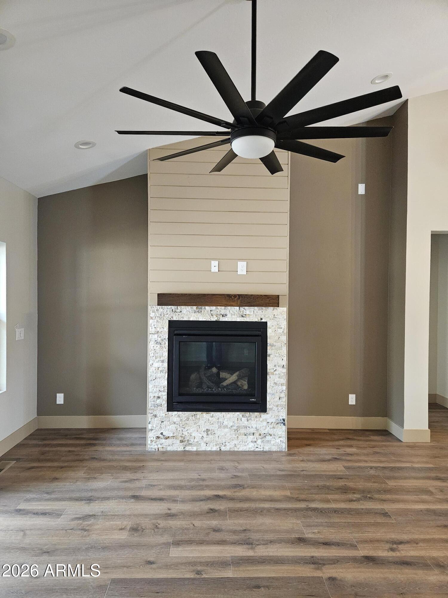 1380 Lakeside Trail Show Low, AZ 85901 - Photo 11 of 48 a view of a livingroom with a fireplace and a ceiling fan