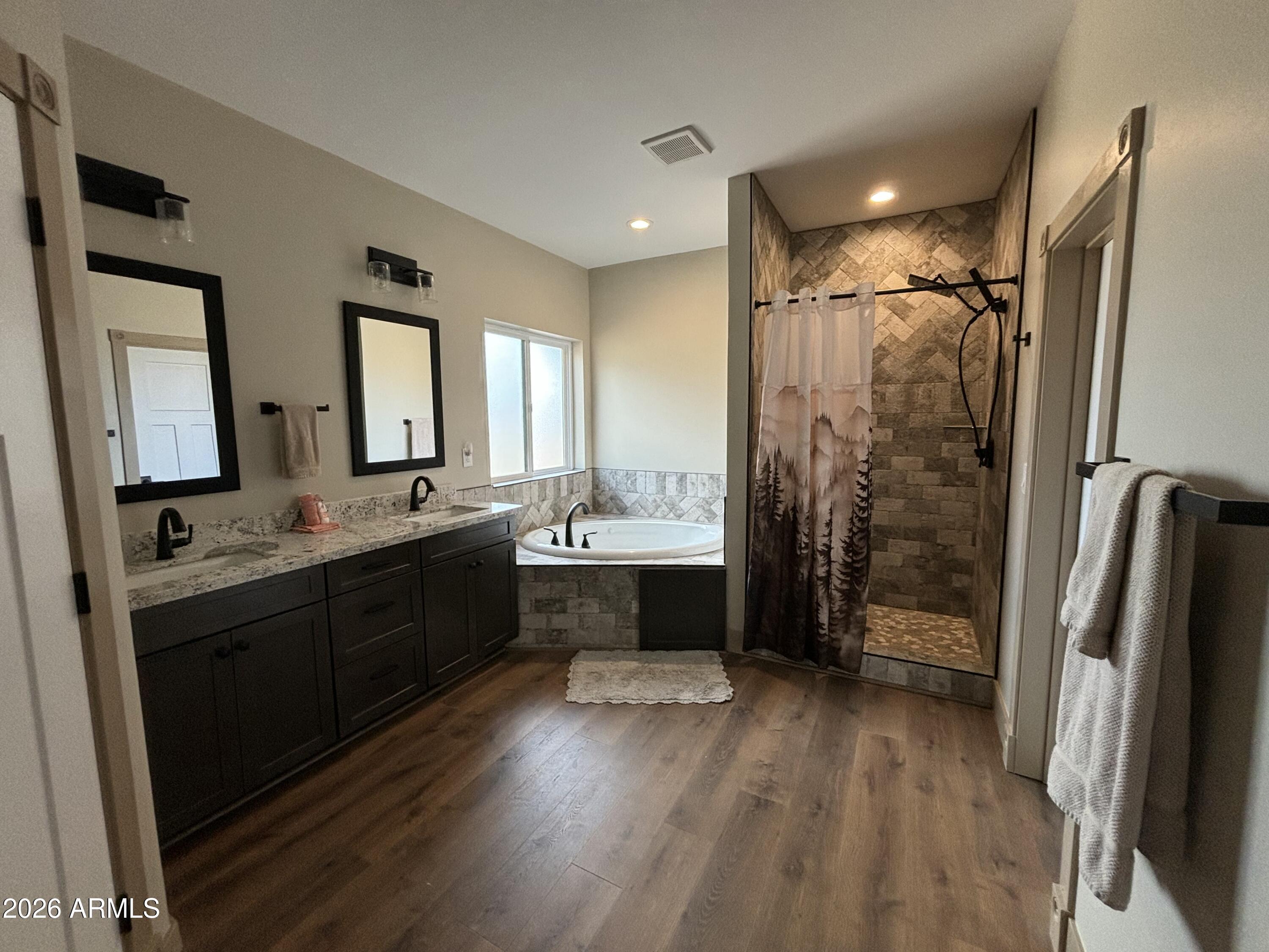 1380 Lakeside Trail Show Low, AZ 85901 - Photo 25 of 48 a bathroom with a double vanity sink a mirror and a shower