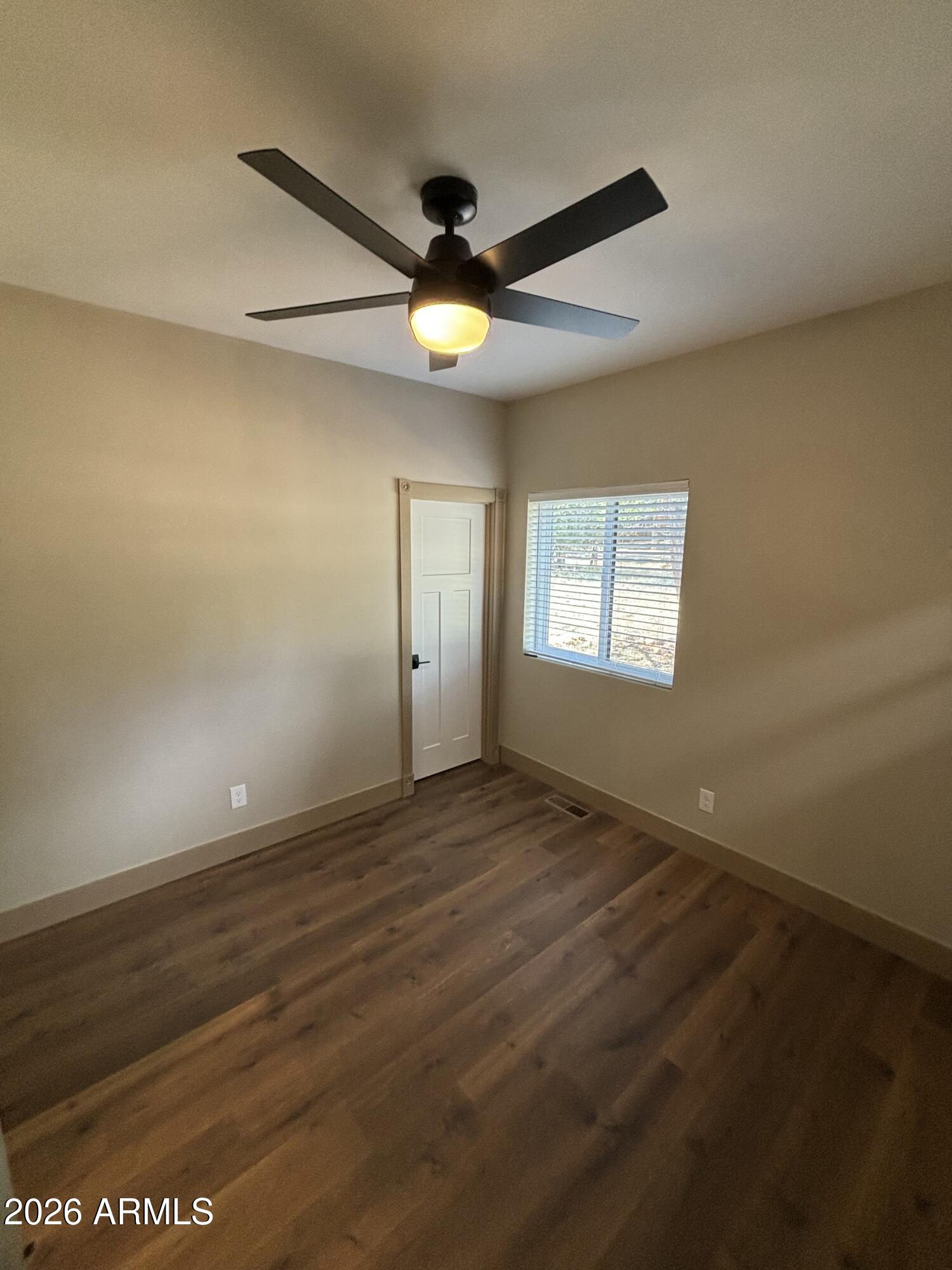1380 Lakeside Trail Show Low, AZ 85901 - Photo 33 of 48 a view of an empty room with window and chandelier fan