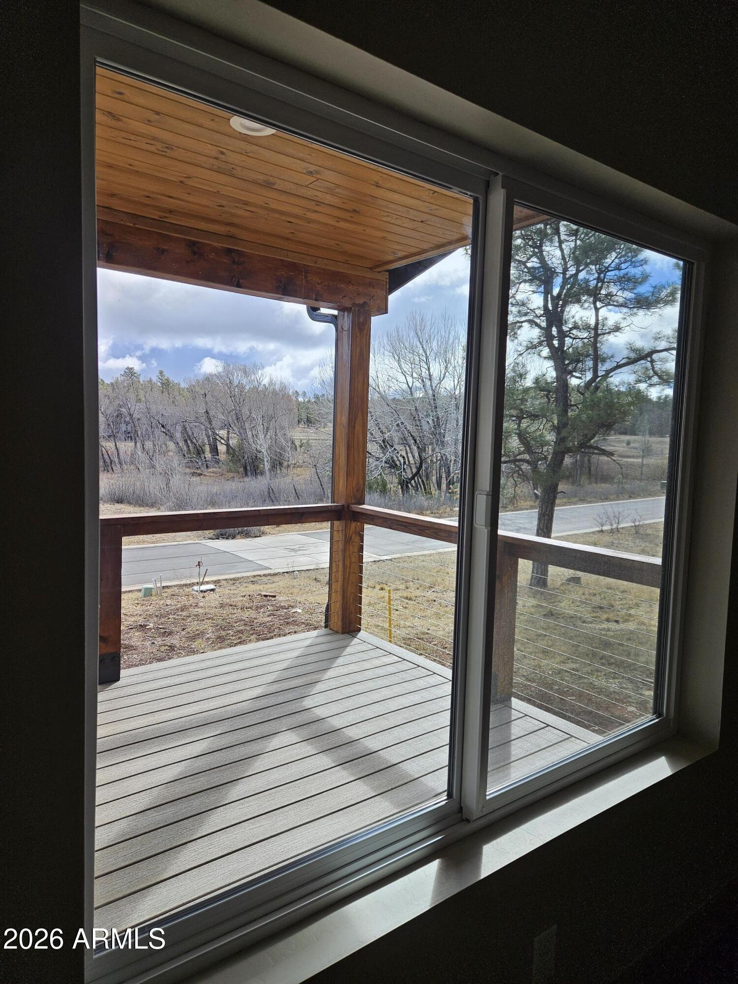 1380 Lakeside Trail Show Low, AZ 85901 - Photo 6 of 48 a view of a room with wooden floor and outdoor view