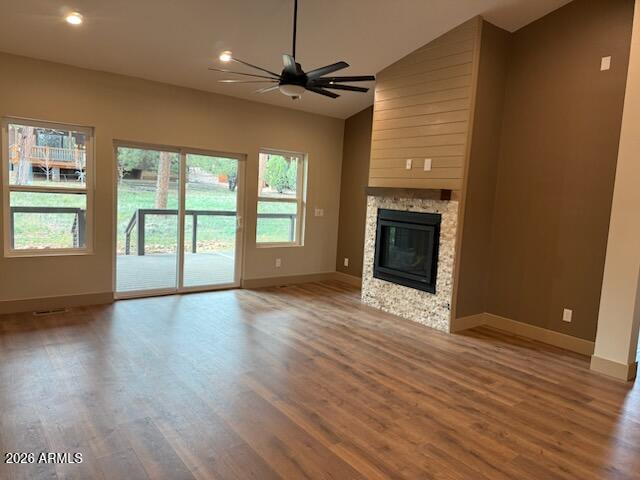 1380 Lakeside Trail Show Low, AZ 85901 - Photo 8 of 48 an empty room with wooden floor fireplace and windows