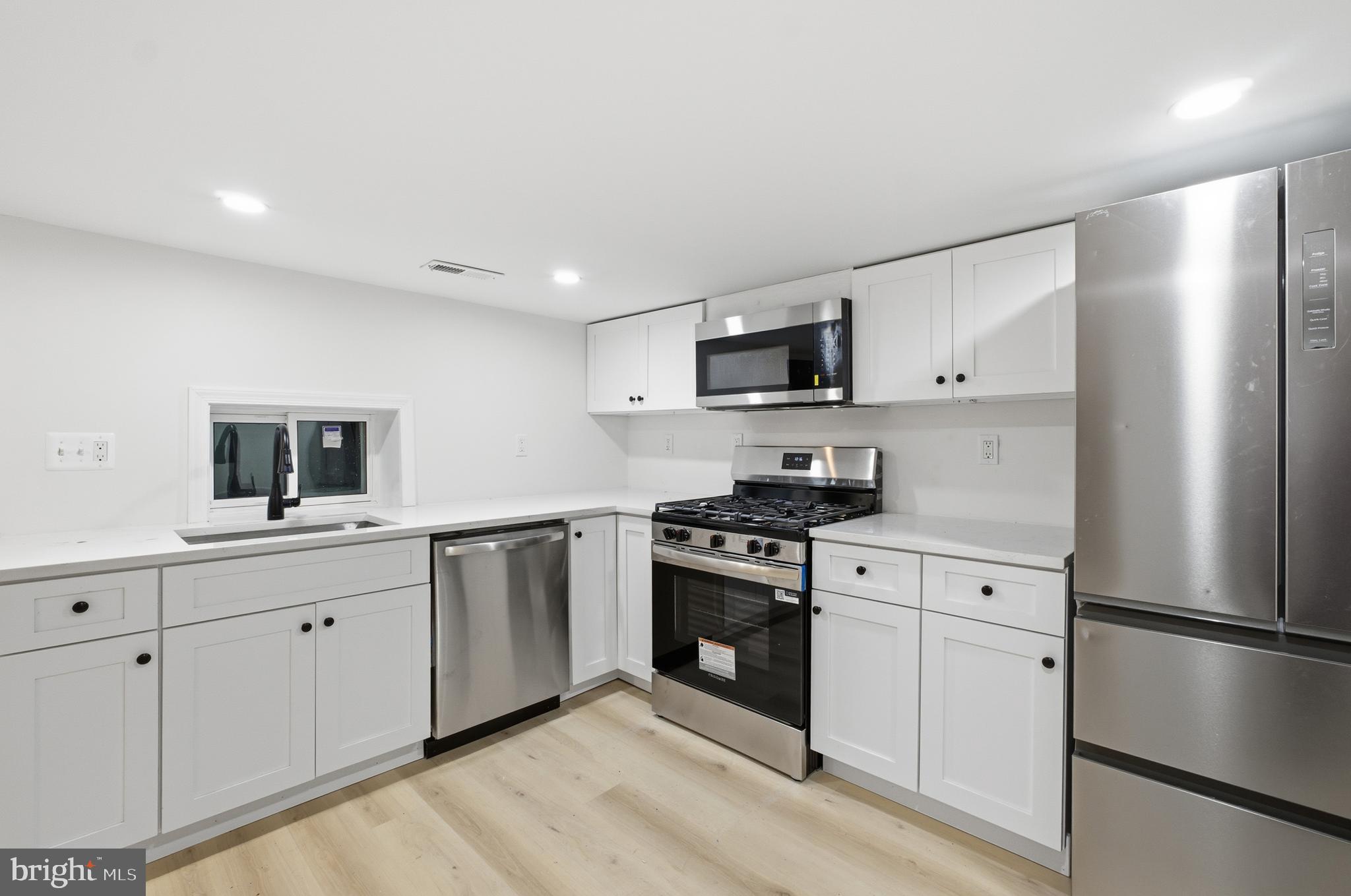 1 Beach Road Glen Burnie, MD 21060 - Photo 14 of 54 a kitchen with stainless steel appliances a refrigerator stove and sink