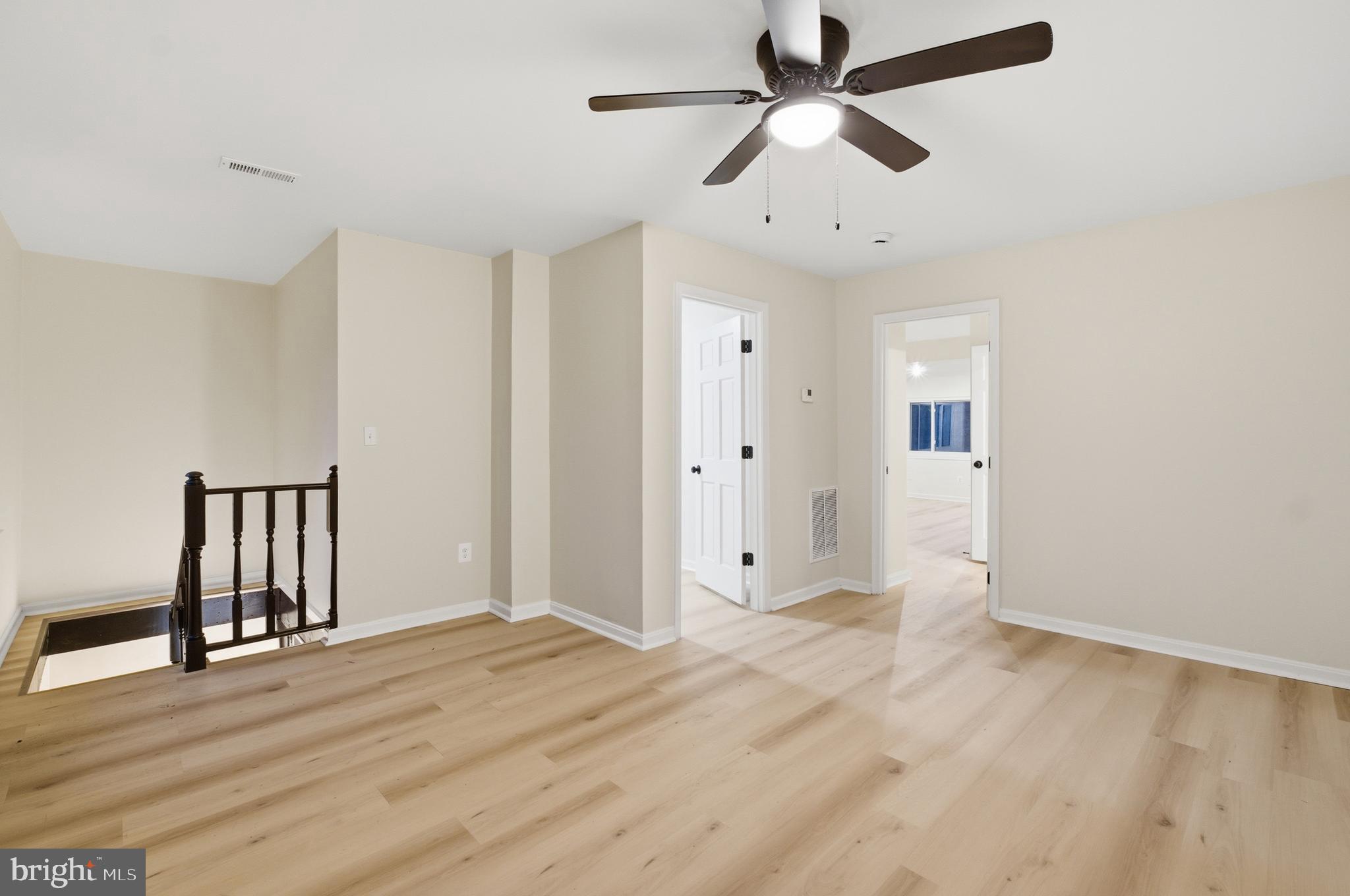 1 Beach Road Glen Burnie, MD 21060 - Photo 15 of 54 wooden floor in an empty room with a window