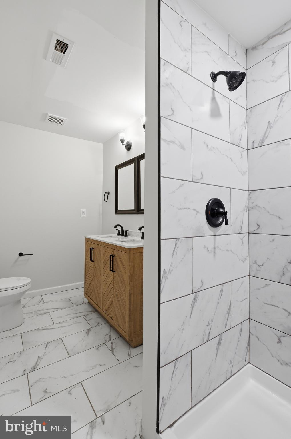 1 Beach Road Glen Burnie, MD 21060 - Photo 20 of 54 a bathroom with a sink and mirror