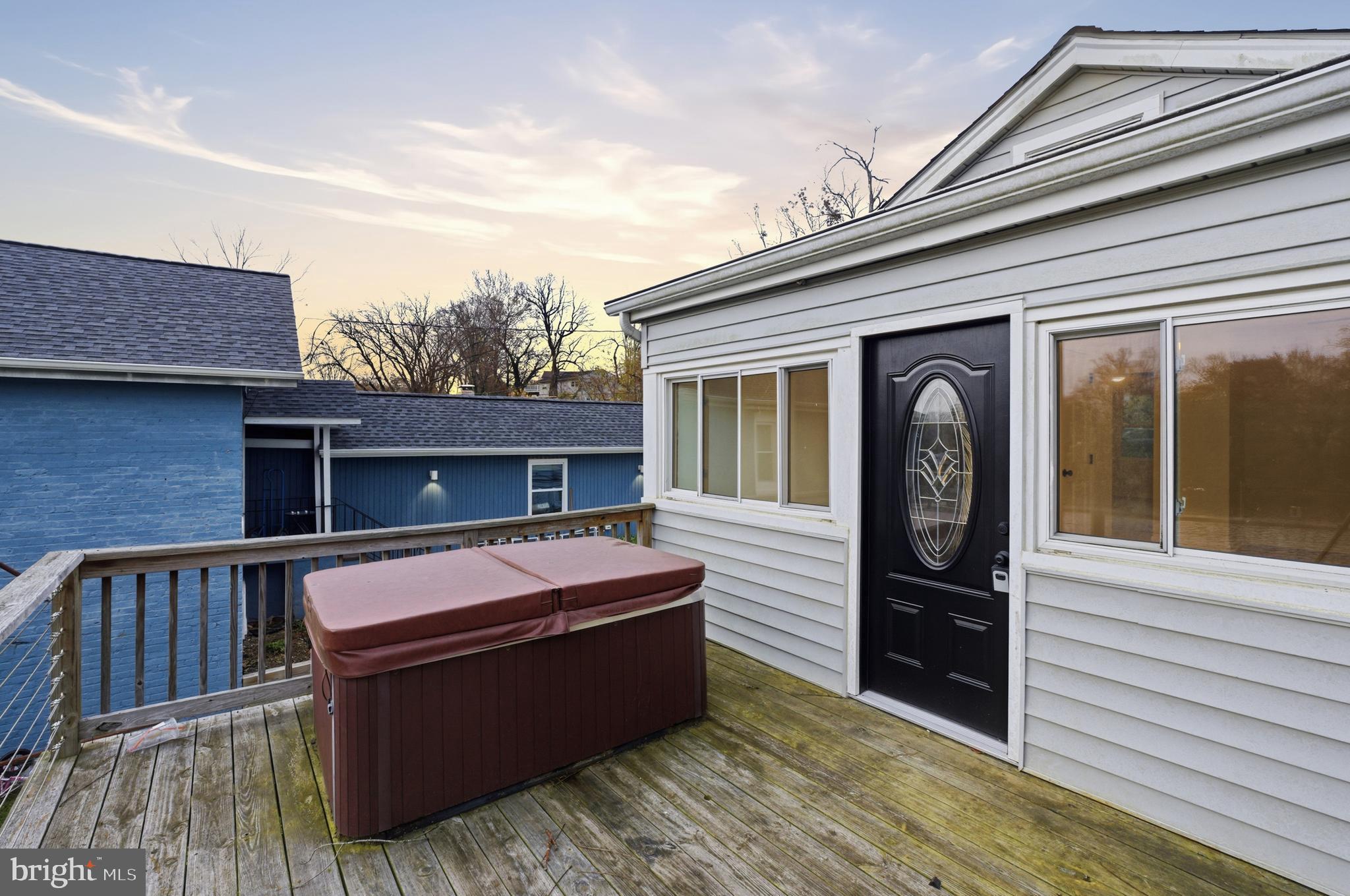 1 Beach Road Glen Burnie, MD 21060 - Photo 26 of 54 a view of a house with a barbeque and wooden fence
