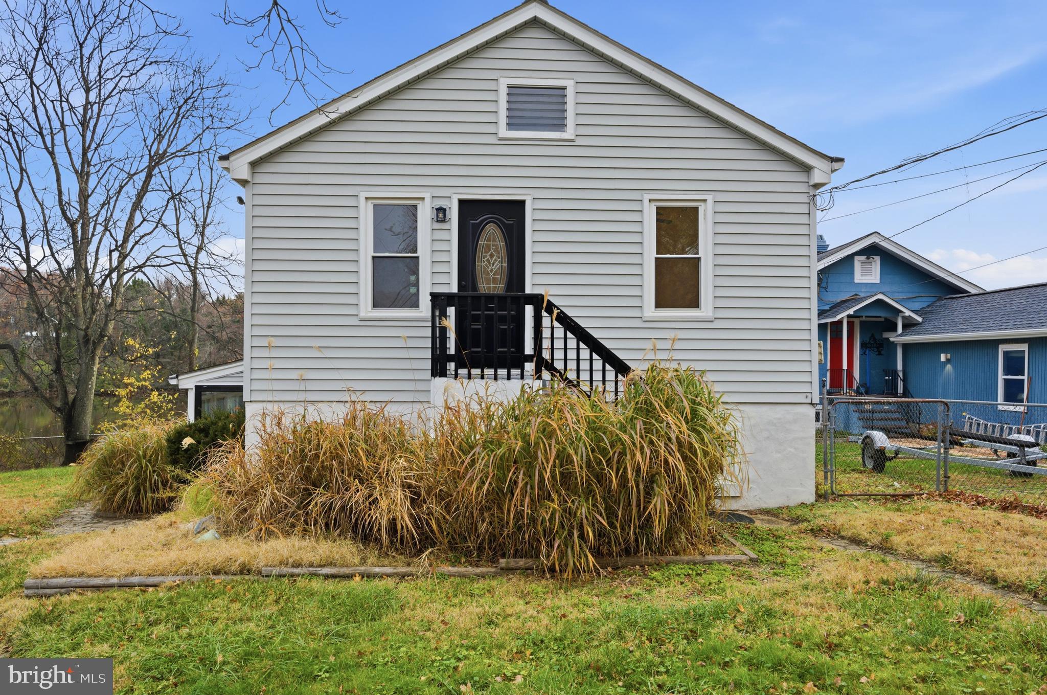 1 Beach Road Glen Burnie, MD 21060 - Photo 3 of 54 a view of a house with backyard and chairs