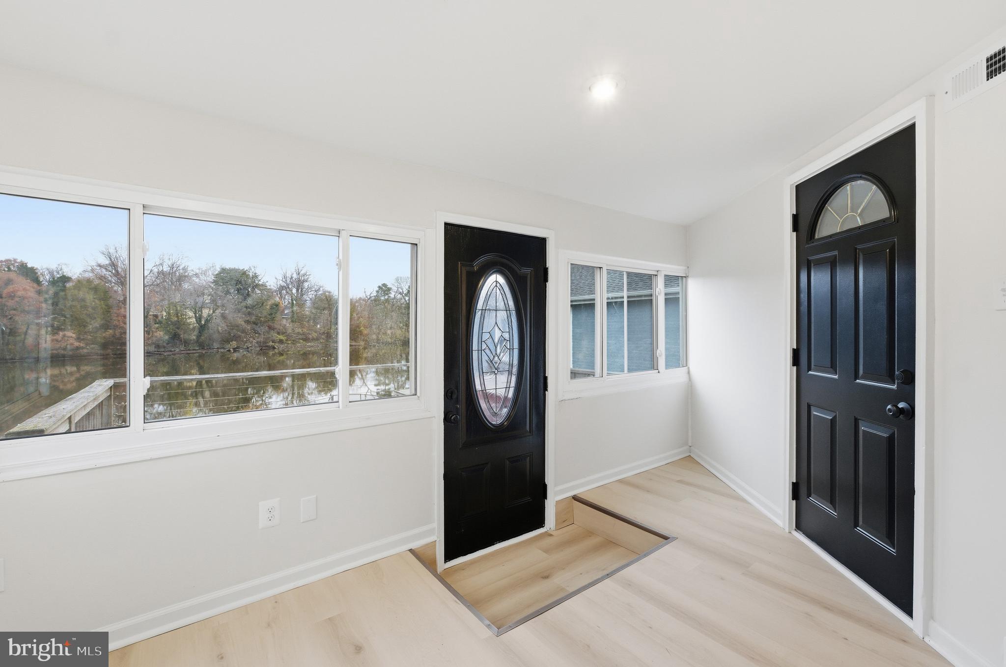 1 Beach Road Glen Burnie, MD 21060 - Photo 5 of 54 a bedroom with a large bed and a large window