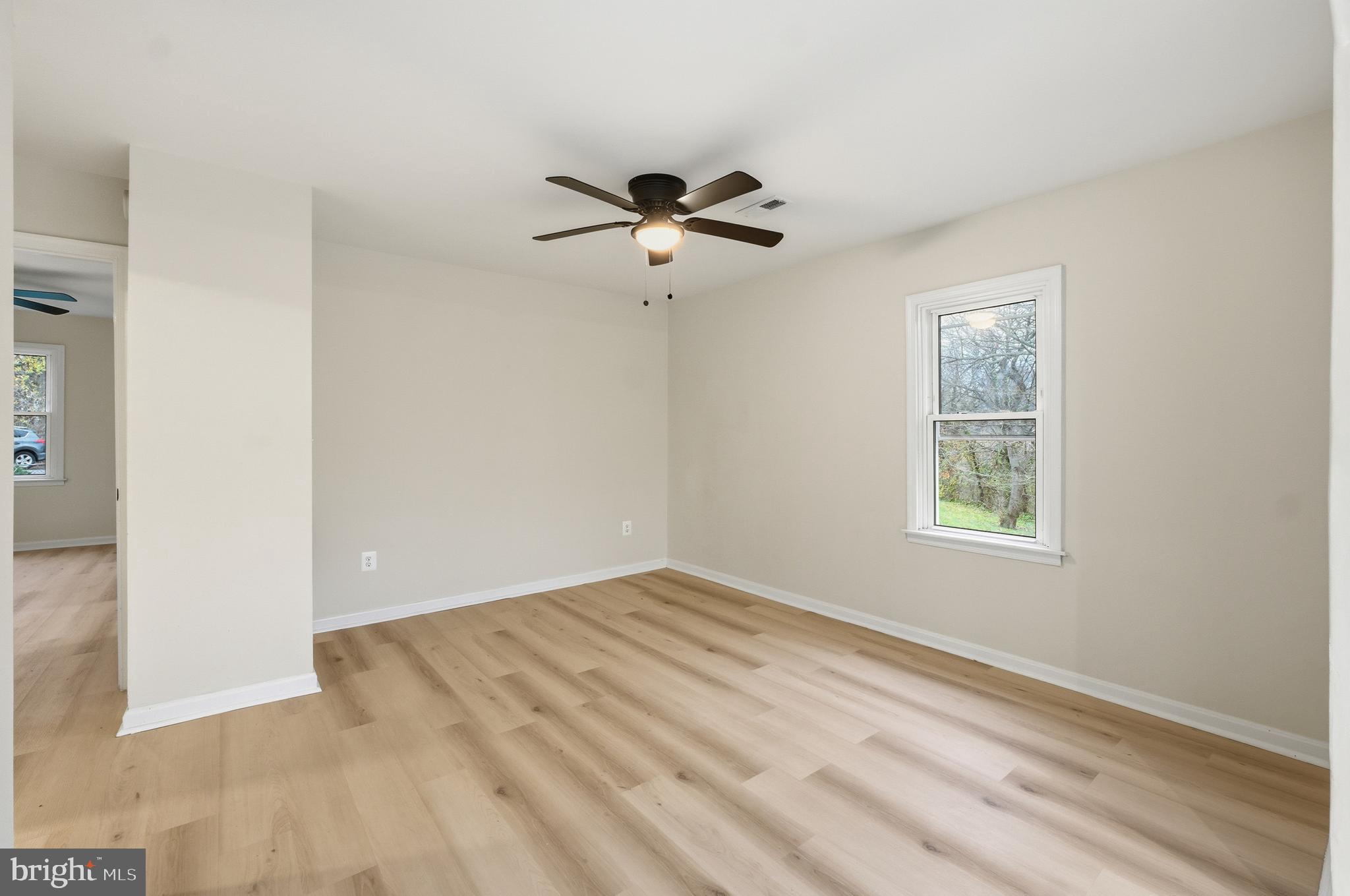 1 Beach Road Glen Burnie, MD 21060 - Photo 6 of 54 an empty room with windows and fan