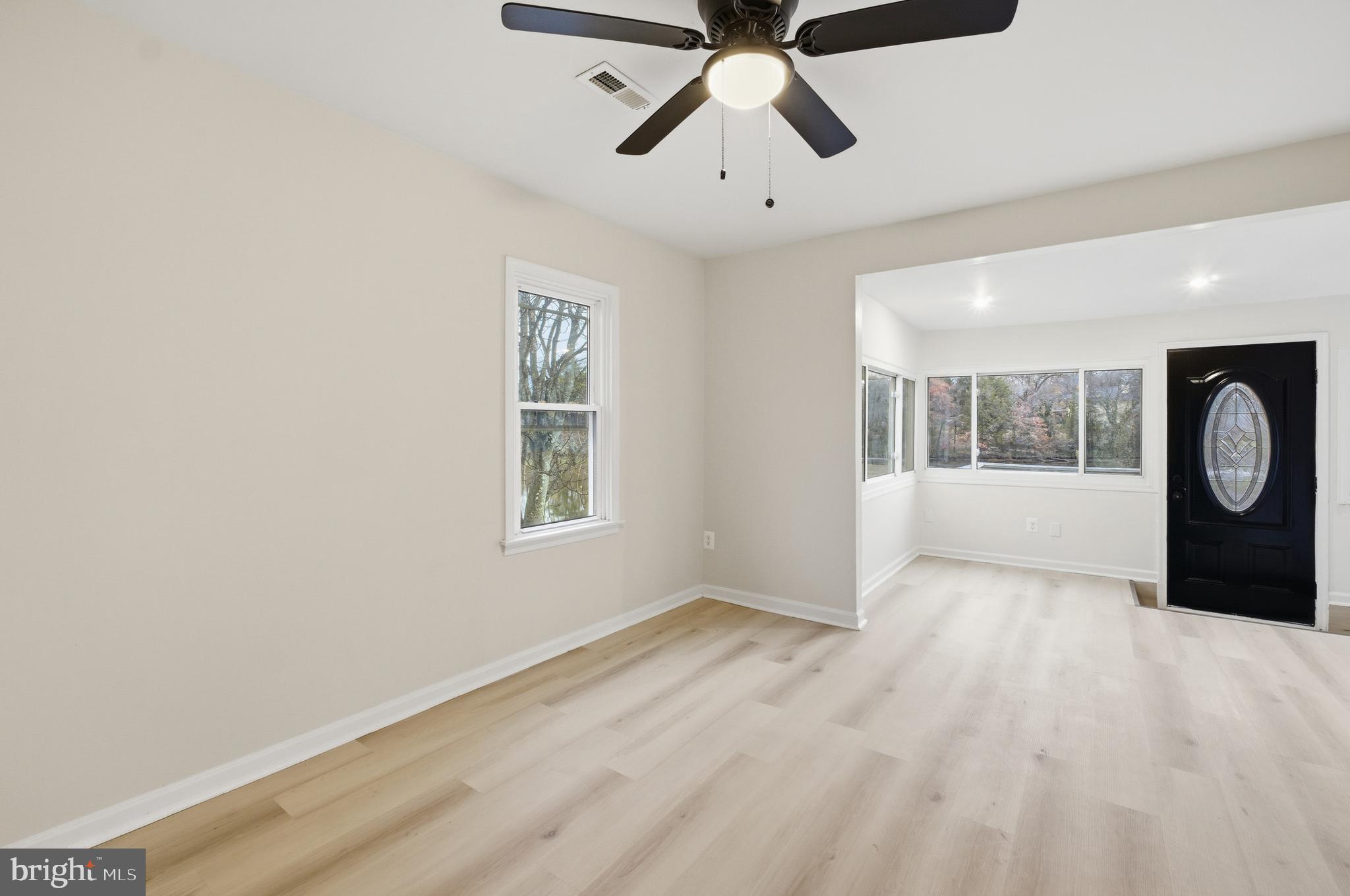 1 Beach Road Glen Burnie, MD 21060 - Photo 7 of 54 an empty room with windows and fan