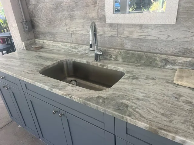 a kitchen with a sink and a window