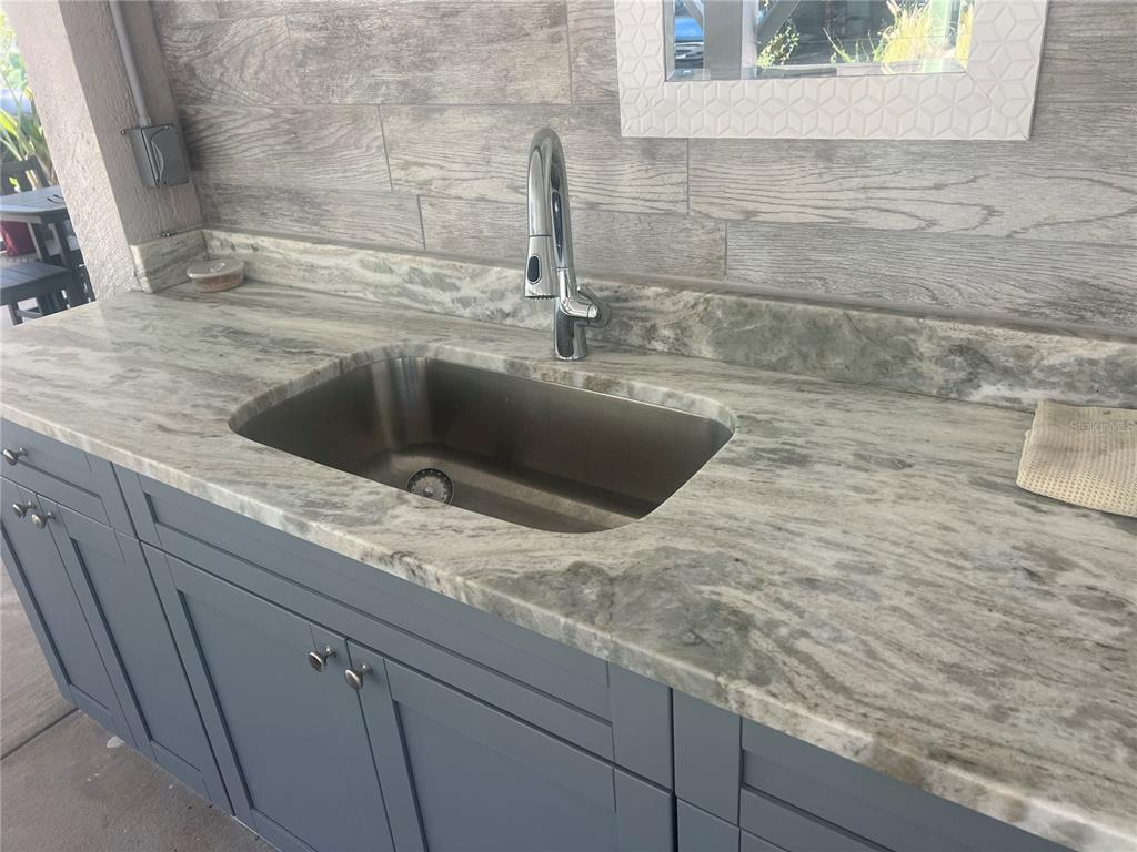 960 Gulf Boulevard, Unit 1 Indian Rocks Beach, FL 33785 - Photo 9 of 15 a kitchen with a sink and a window