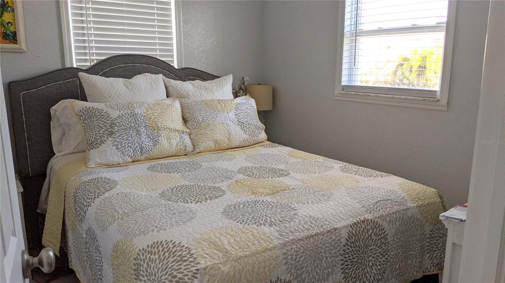 960 Gulf Boulevard, Unit 1 Indian Rocks Beach, FL 33785 - Photo 10 of 15 a large white bed in a small room