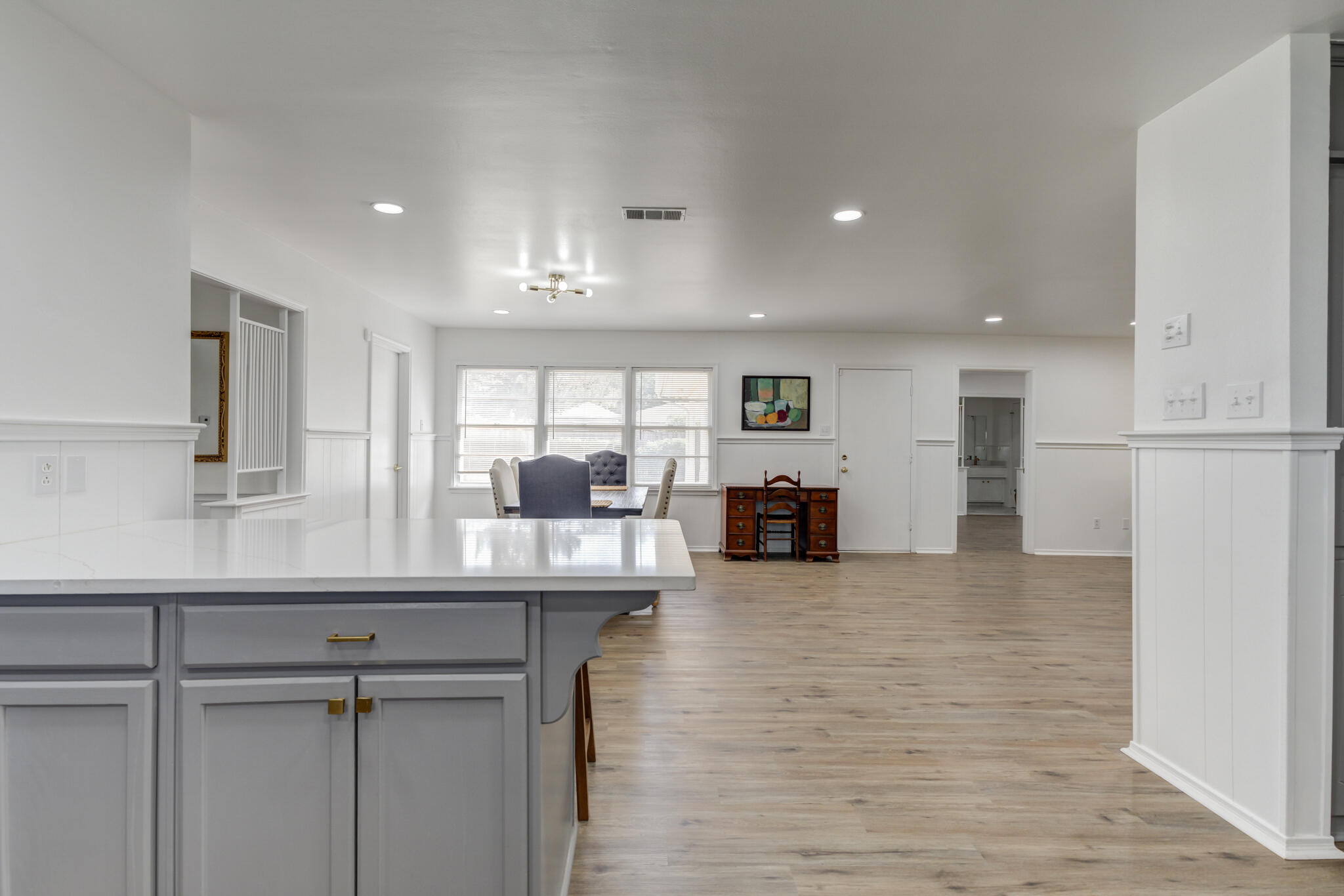 3023 66th Street Lubbock, TX 79413 - Photo 11 of 40 a kitchen with counter top space cabinets and appliances