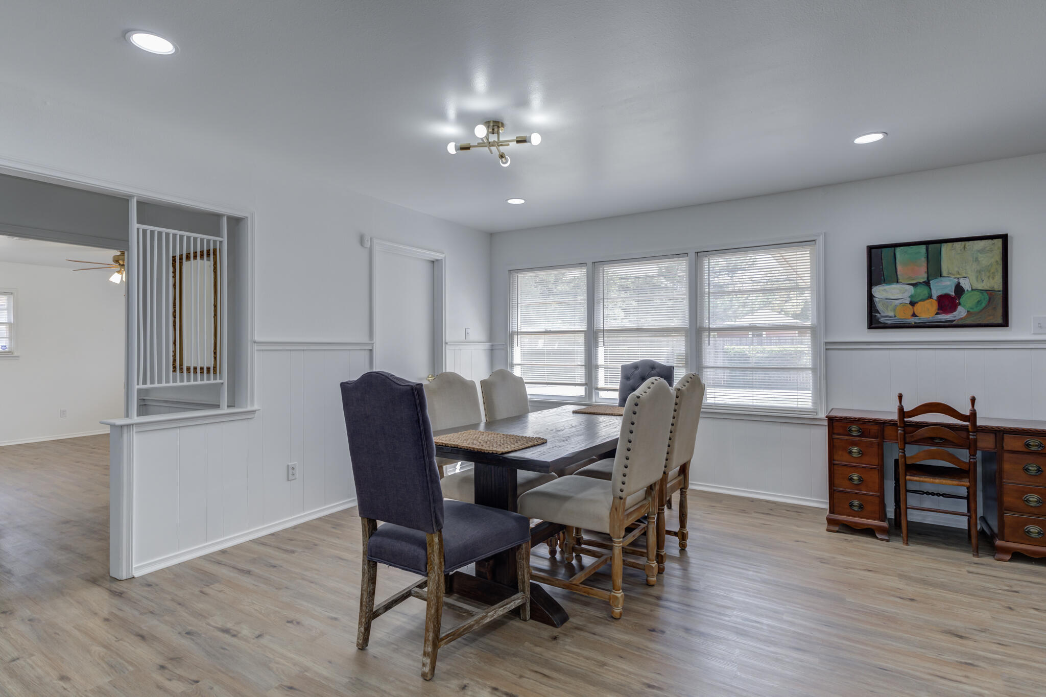 3023 66th Street Lubbock, TX 79413 - Photo 13 of 40 a view of a dining room with furniture window and wooden floor