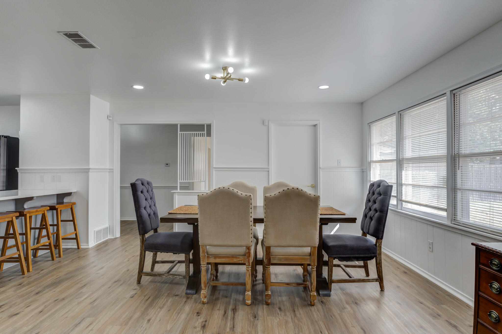3023 66th Street Lubbock, TX 79413 - Photo 14 of 40 a view of a dining room with furniture window and wooden floor