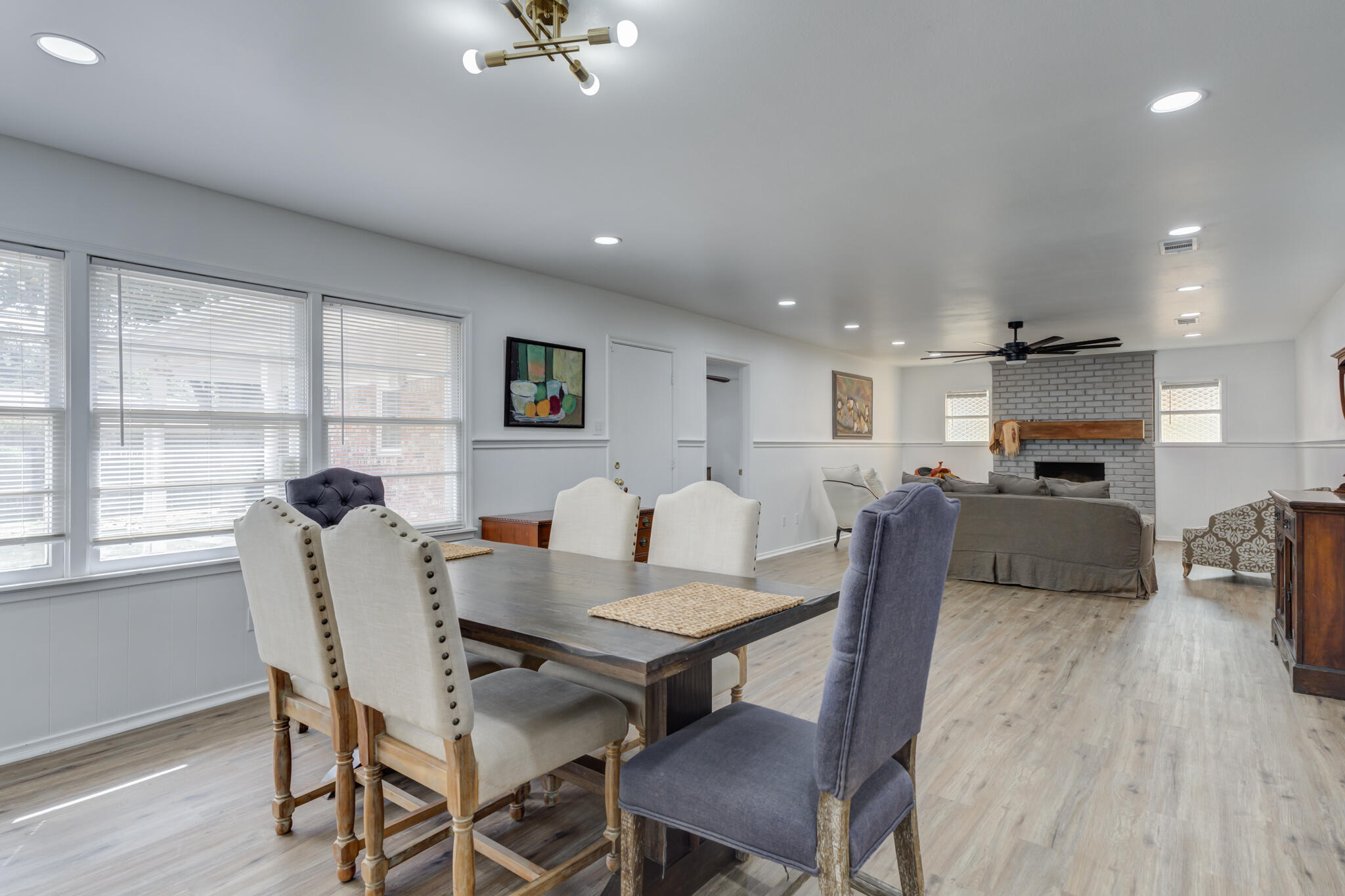 3023 66th Street Lubbock, TX 79413 - Photo 15 of 40 a view of a dining room with furniture window and wooden floor