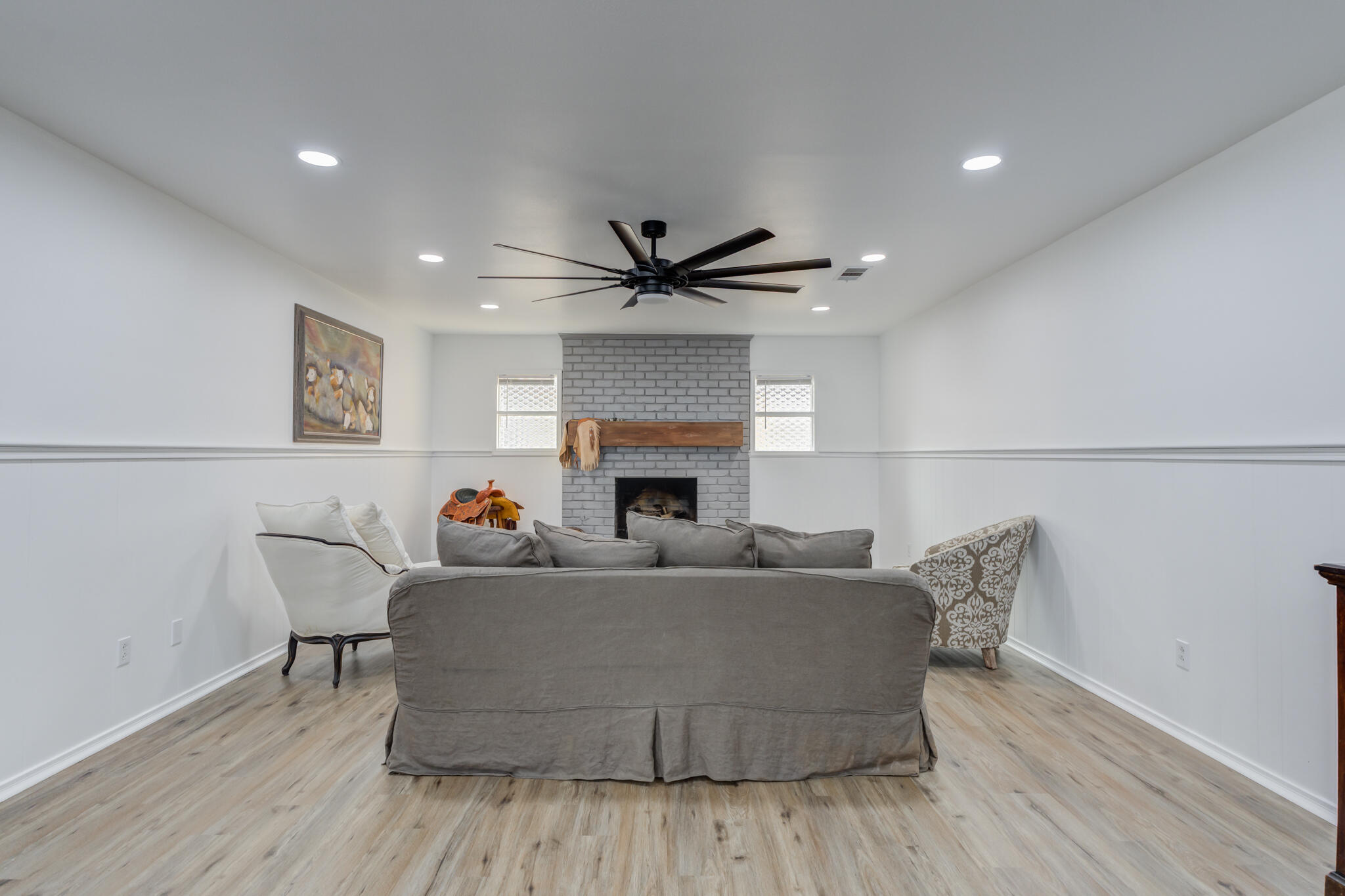 3023 66th Street Lubbock, TX 79413 - Photo 16 of 40 a living room with furniture and a fireplace