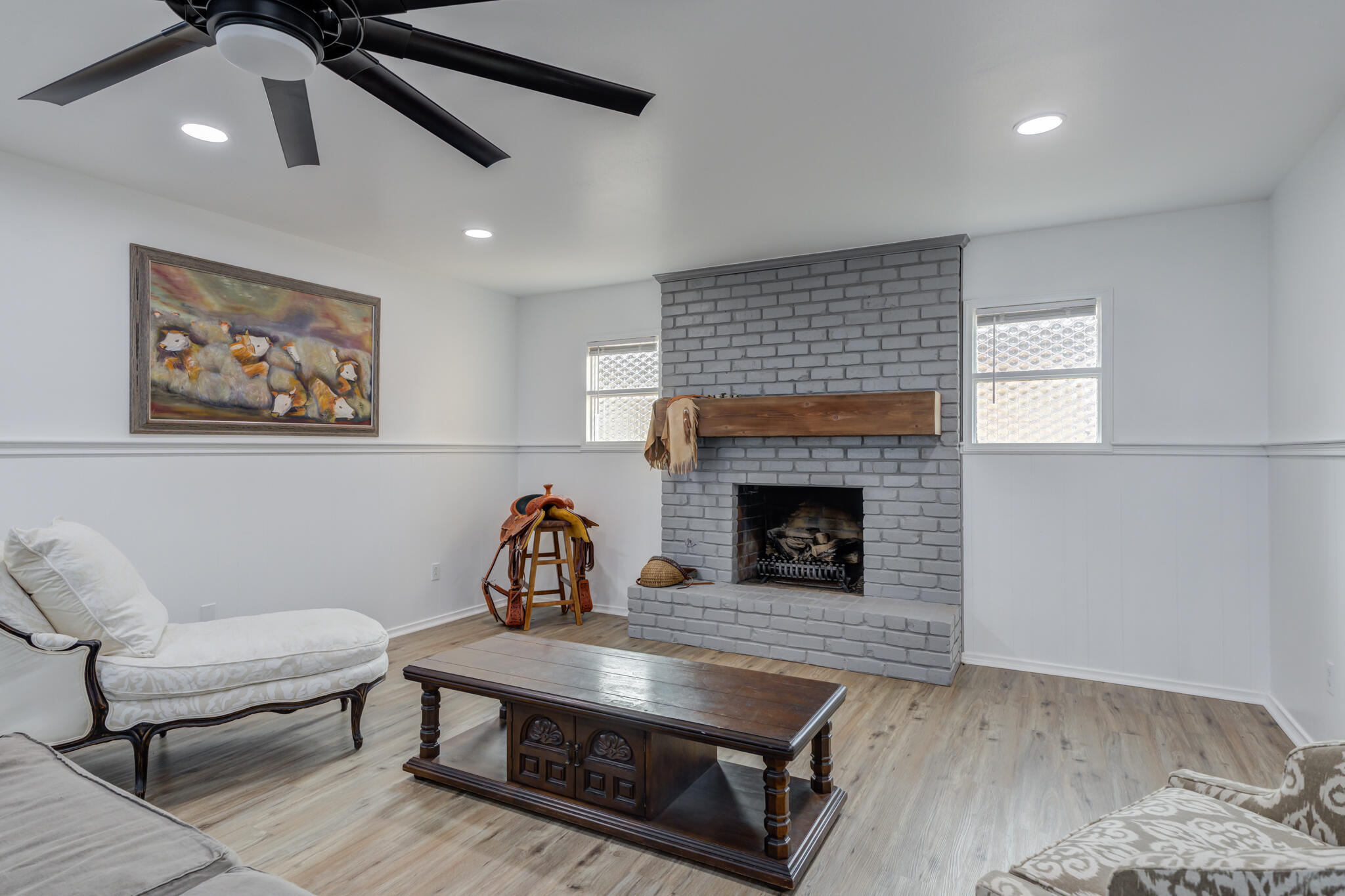 3023 66th Street Lubbock, TX 79413 - Photo 18 of 40 a living room with furniture and a fireplace