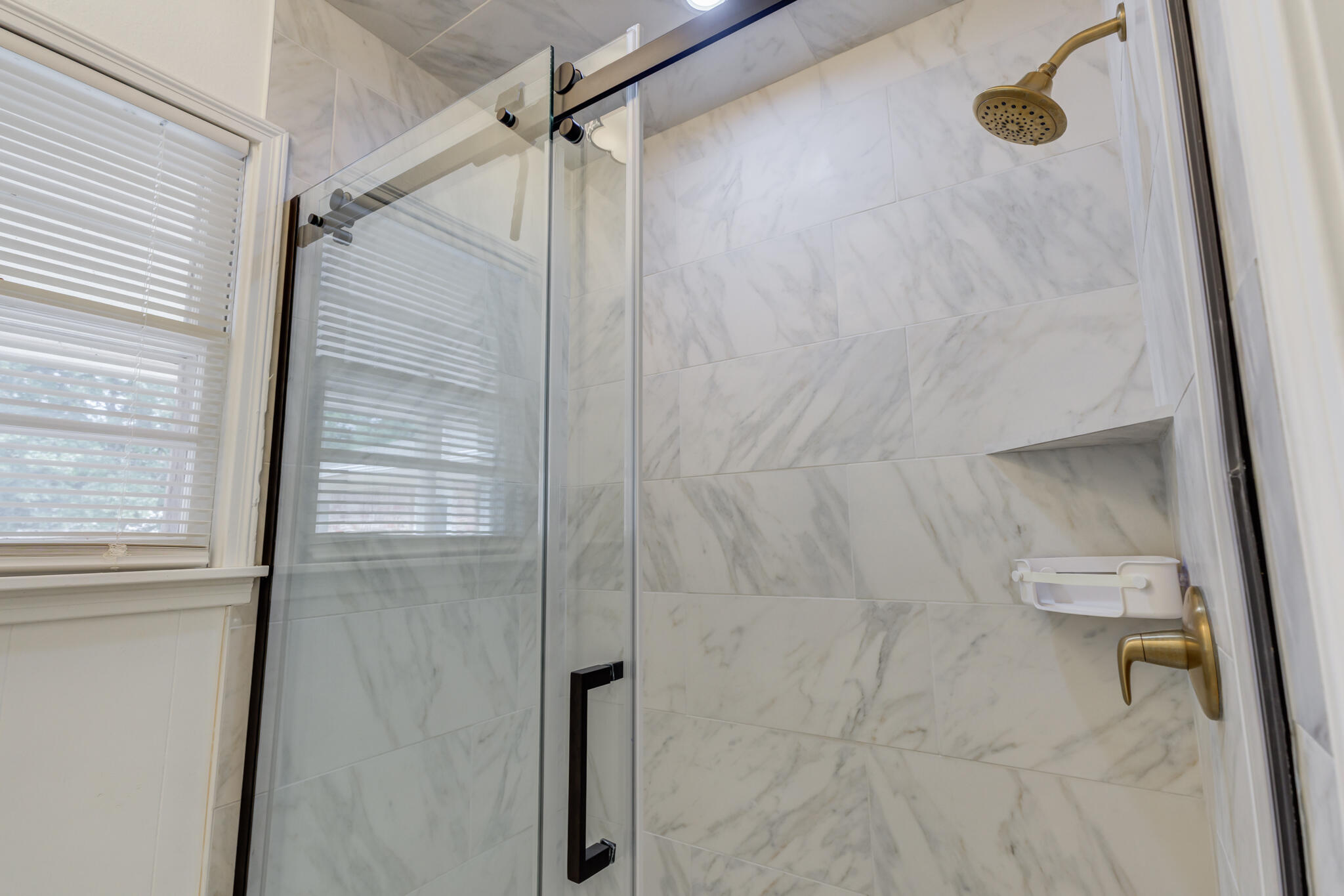 3023 66th Street Lubbock, TX 79413 - Photo 26 of 40 a bathroom with a shower