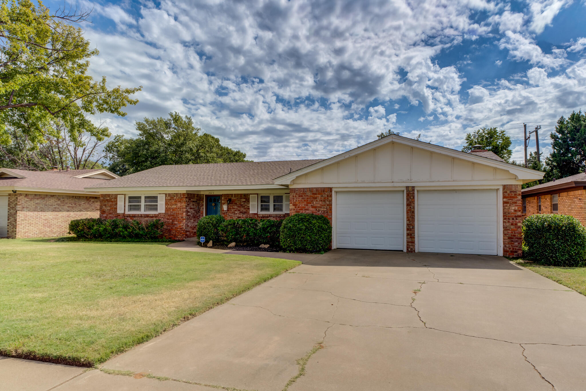 3023 66th Street Lubbock, TX 79413 - Photo 3 of 40 a front view of a house with yard and green space
