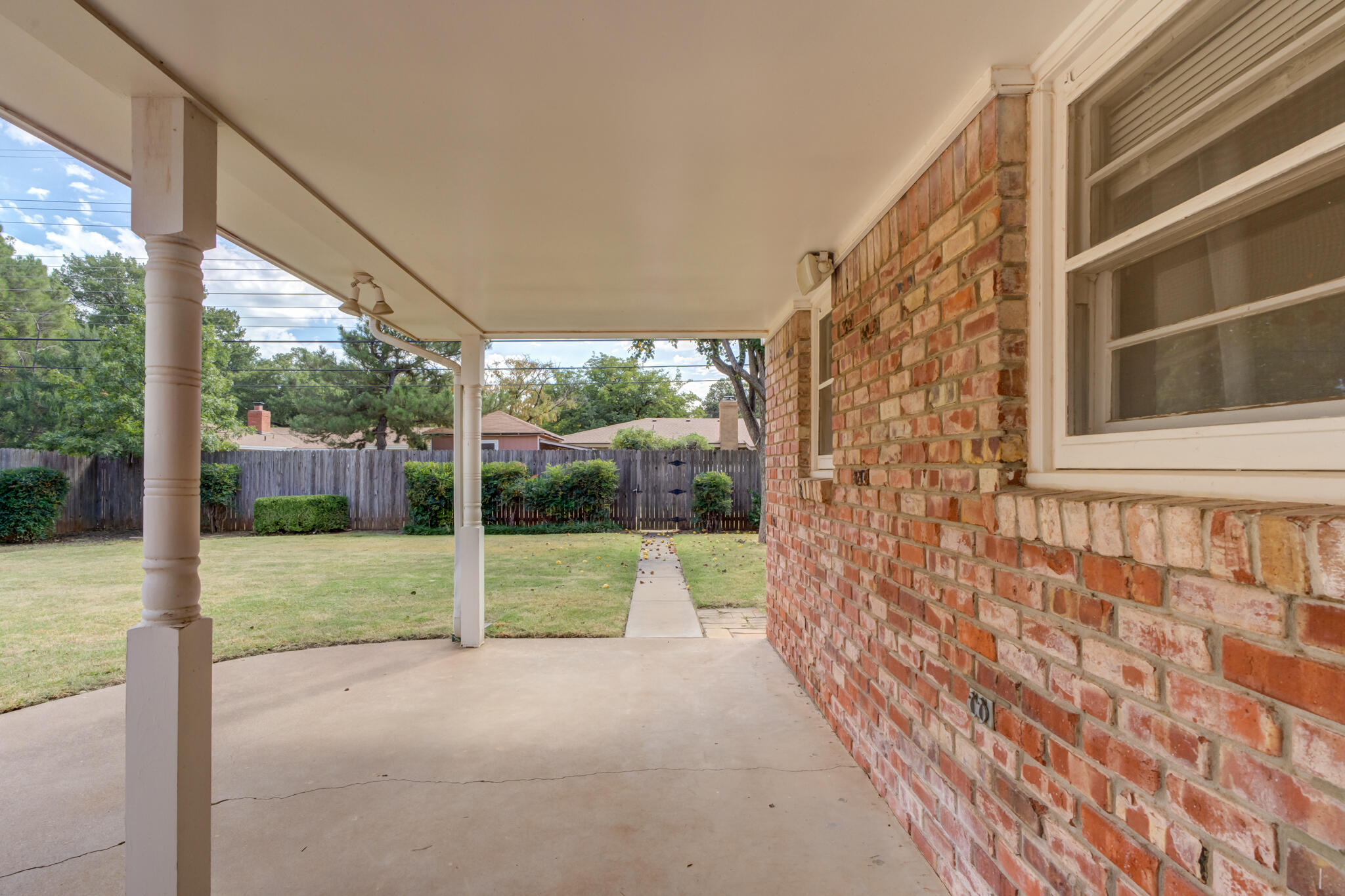 3023 66th Street Lubbock, TX 79413 - Photo 35 of 40 a view of a house with backyard and porch