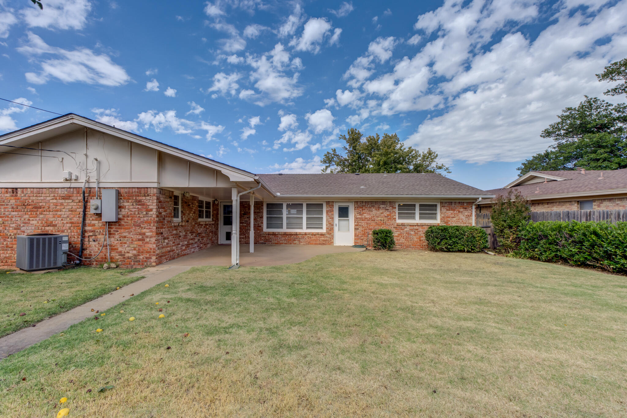 3023 66th Street Lubbock, TX 79413 - Photo 39 of 40 a front view of a house with a garden