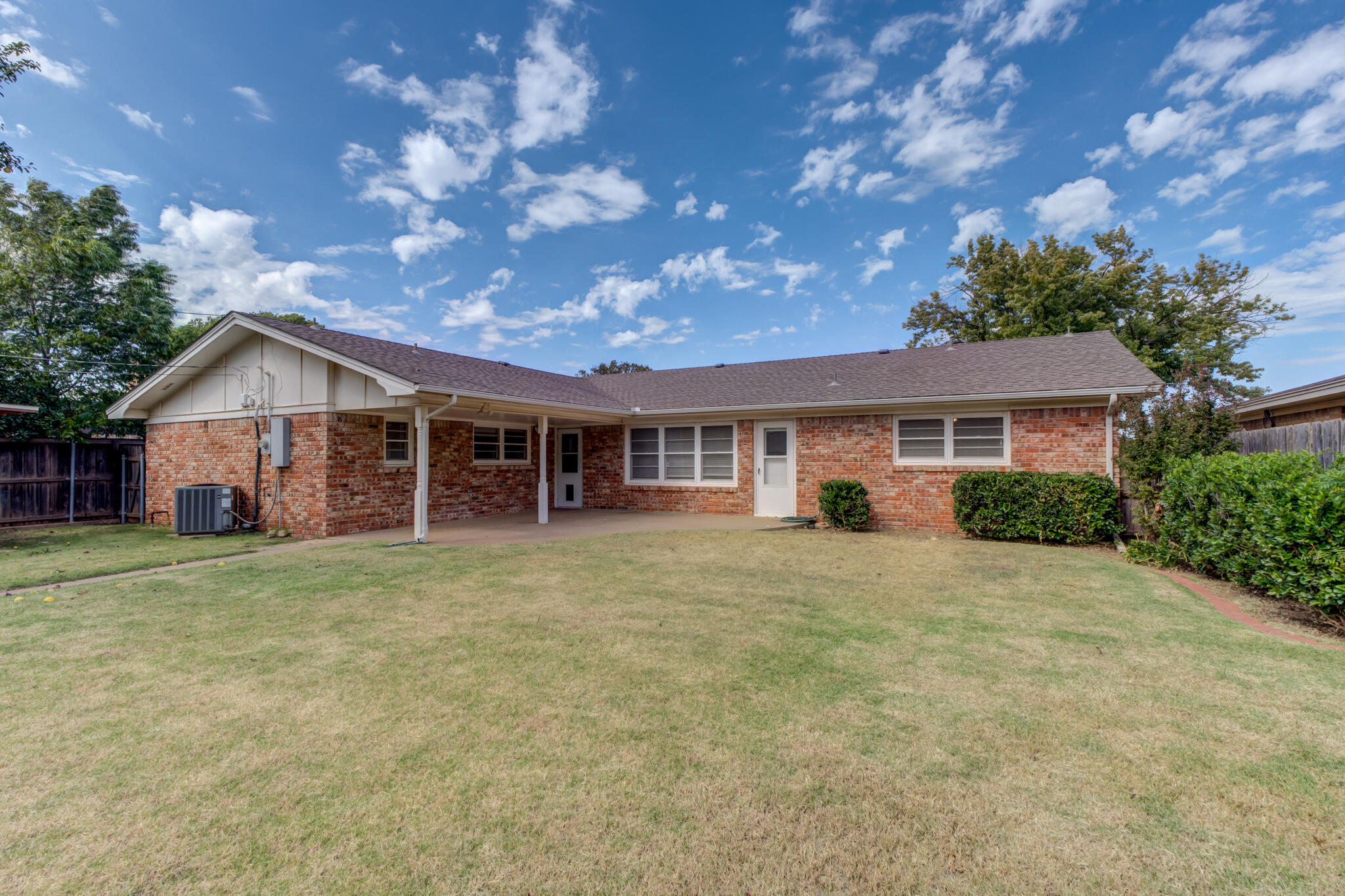 3023 66th Street Lubbock, TX 79413 - Photo 40 of 40 a front view of a house with a garden