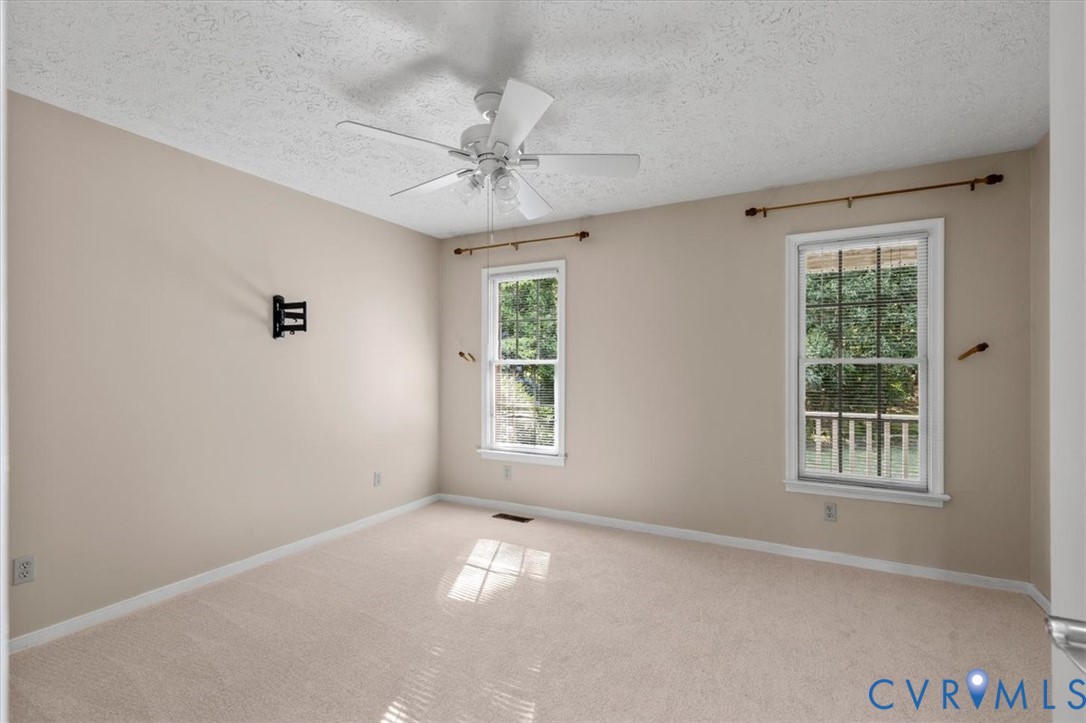 1437 Palmore Road Powhatan, VA 23139 - Photo 23 of 60 Carpeted room featuring a ceiling fan, two double-
