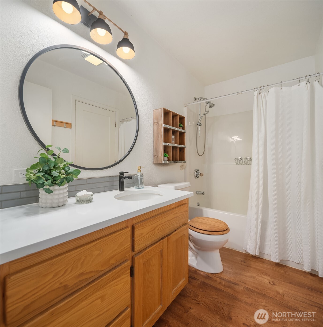 12908 Southwest 244th Place Vashon, WA 98070 - Photo 16 of 30 a bathroom with a toilet a sink and a mirror