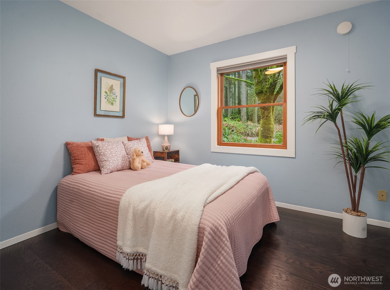 12908 Southwest 244th Place Vashon, WA 98070 - Photo 18 of 30 a bedroom with bed and a potted plant