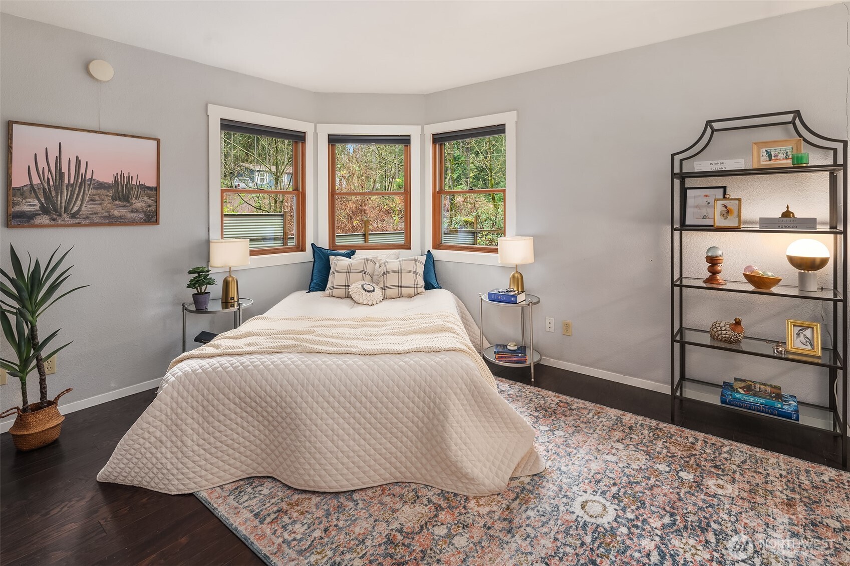 12908 Southwest 244th Place Vashon, WA 98070 - Photo 19 of 30 a bedroom with a bed and wooden floor