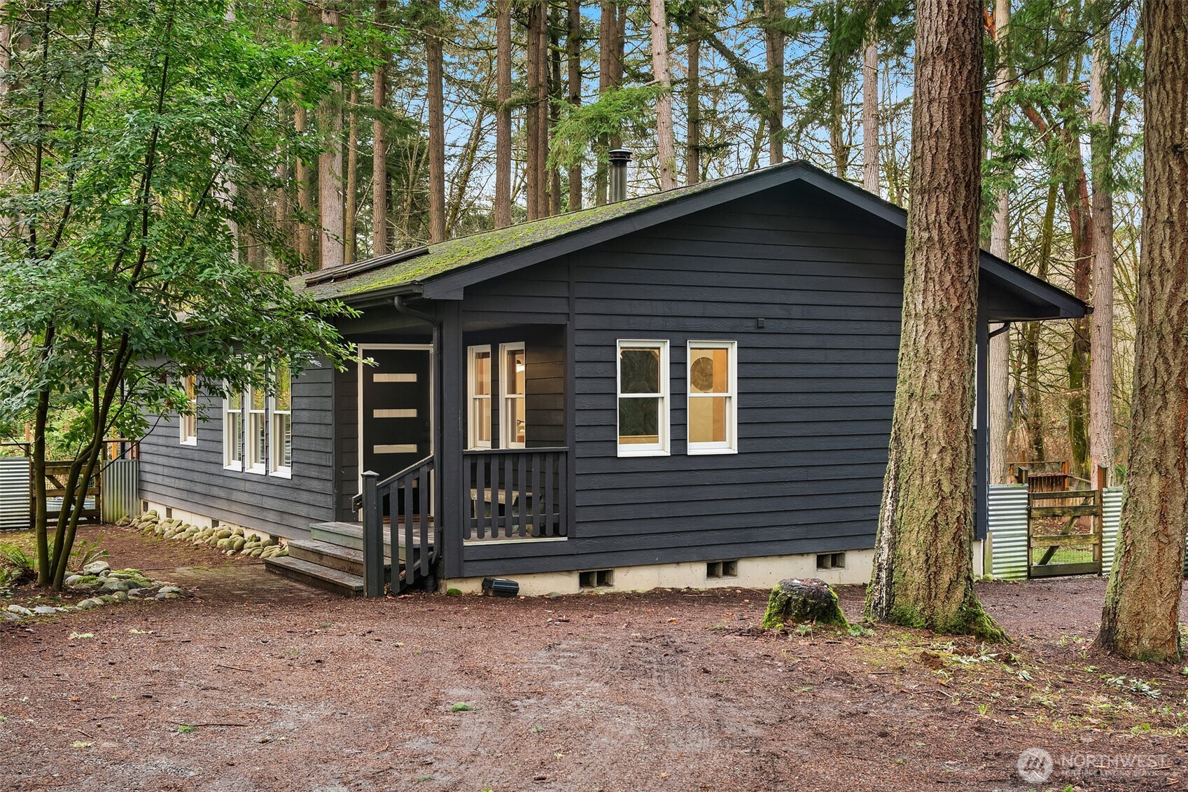 12908 Southwest 244th Place Vashon, WA 98070 - Photo 2 of 30 a front view of a house with a yard