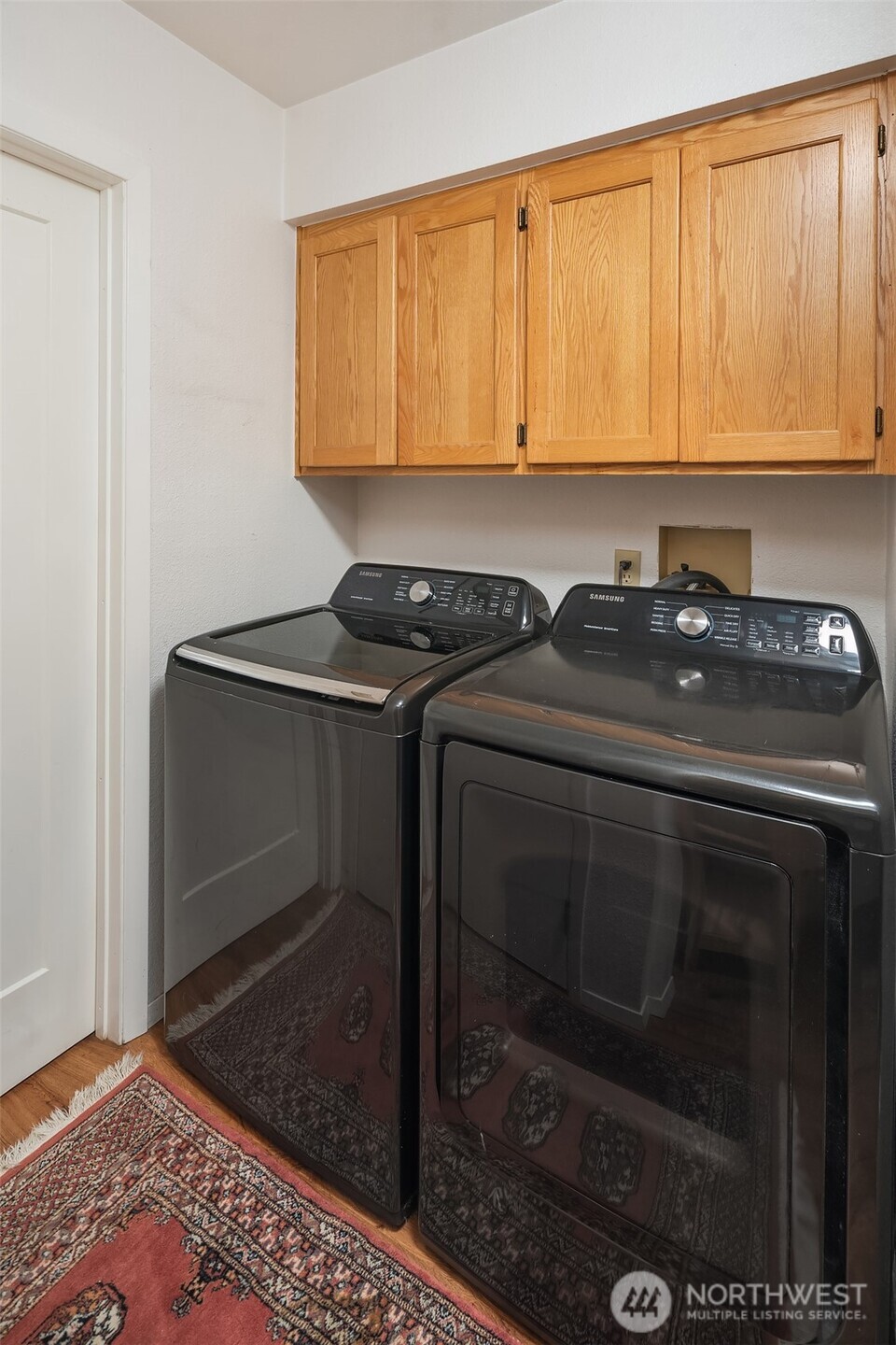 12908 Southwest 244th Place Vashon, WA 98070 - Photo 22 of 30 a kitchen with a sink stove and cabinets