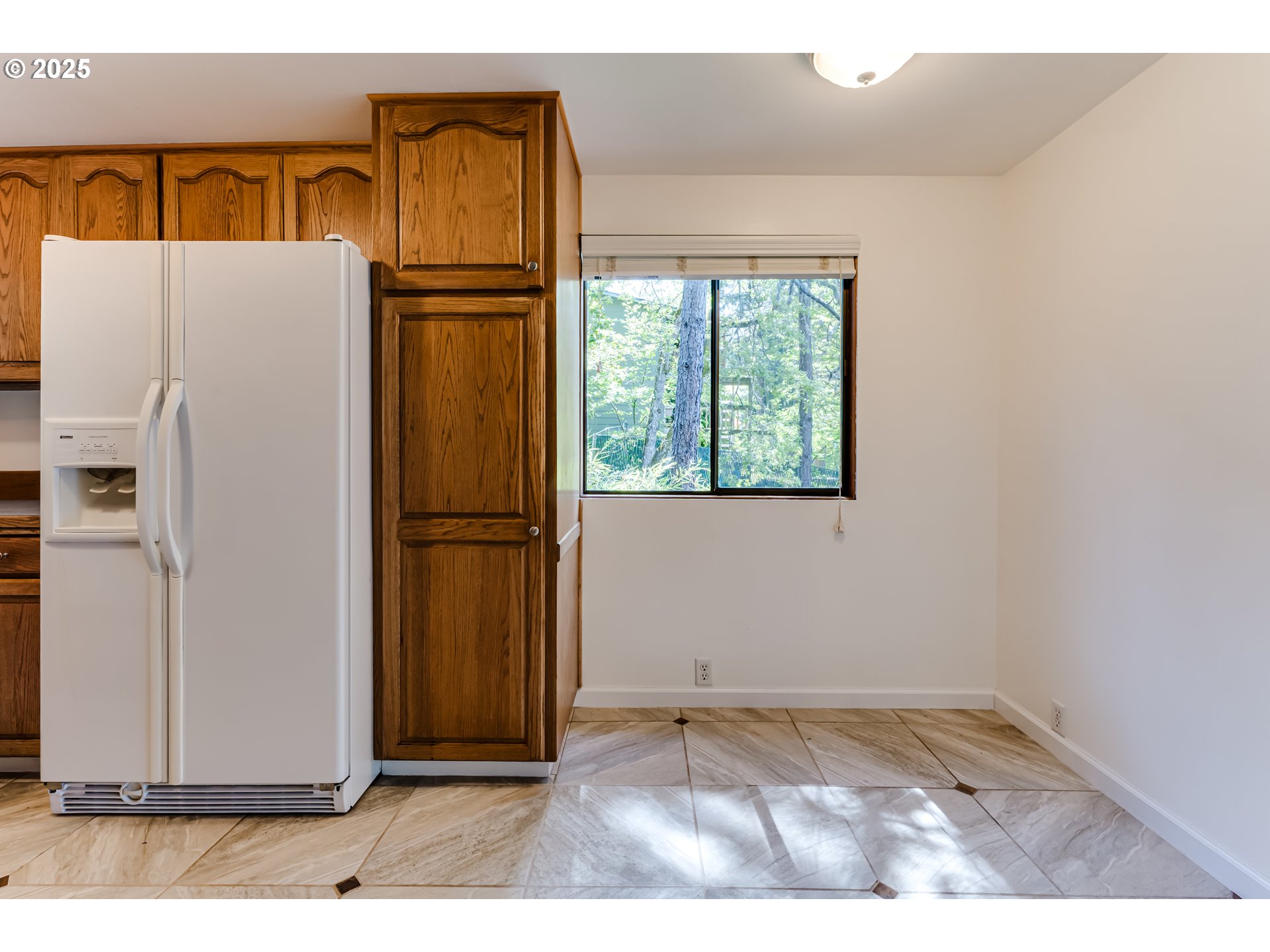 5140 Saratoga Street Eugene, OR 97405 - Photo 13 of 45 a view of a refrigerator in the kitchen