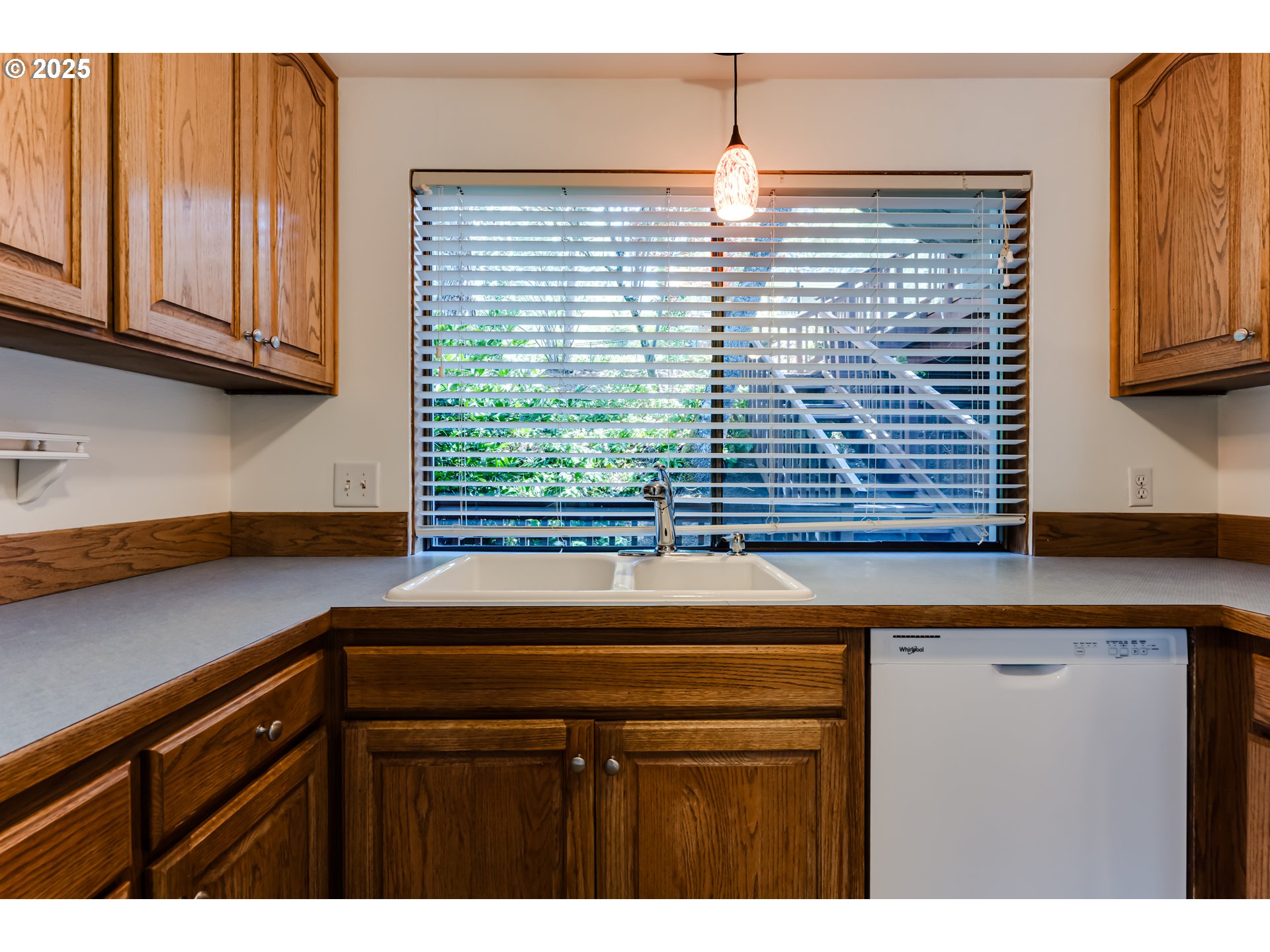 5140 Saratoga Street Eugene, OR 97405 - Photo 14 of 45 a kitchen with a sink and cabinets