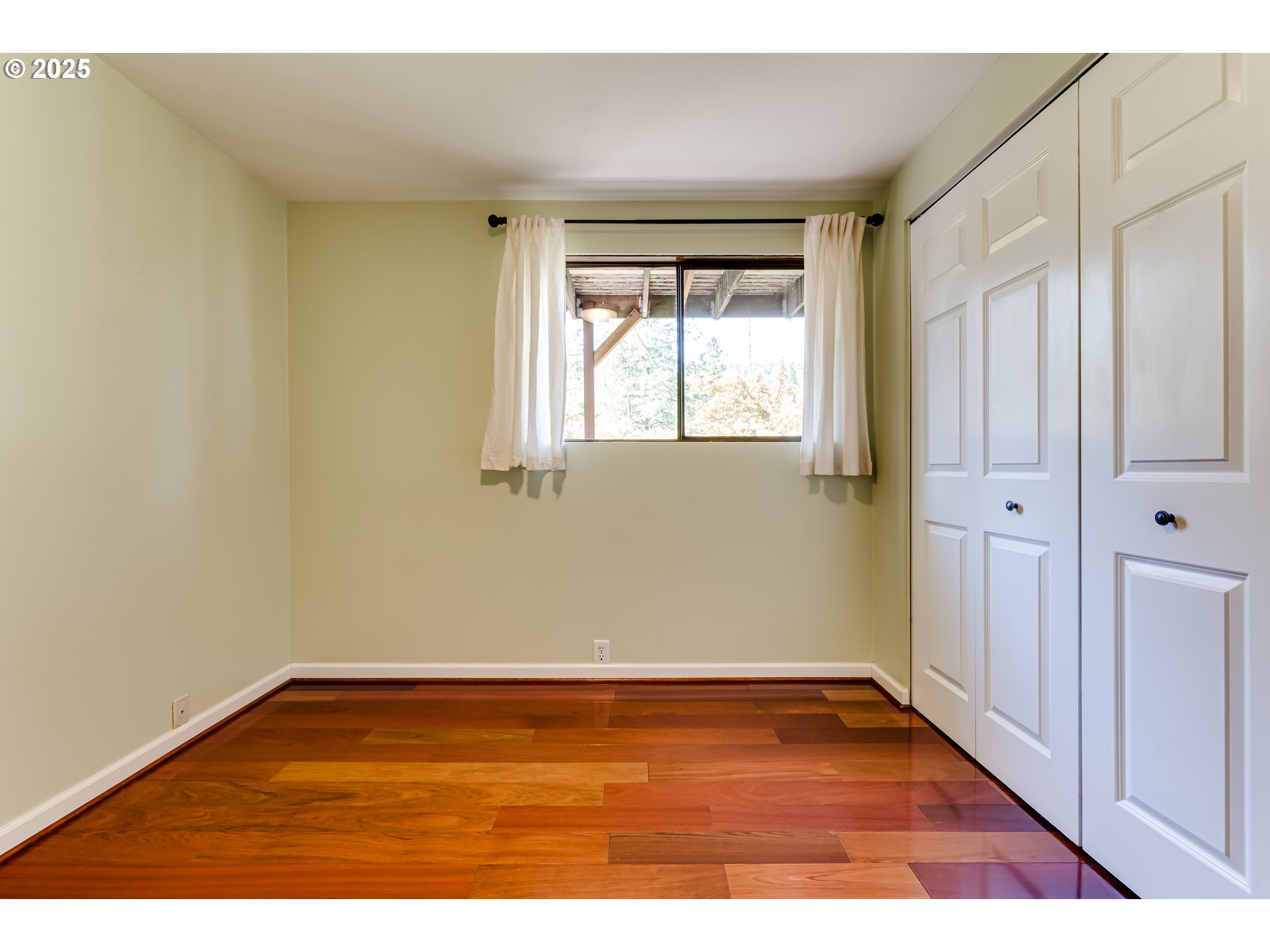 5140 Saratoga Street Eugene, OR 97405 - Photo 33 of 45 a view of an empty room with wooden floor and a window