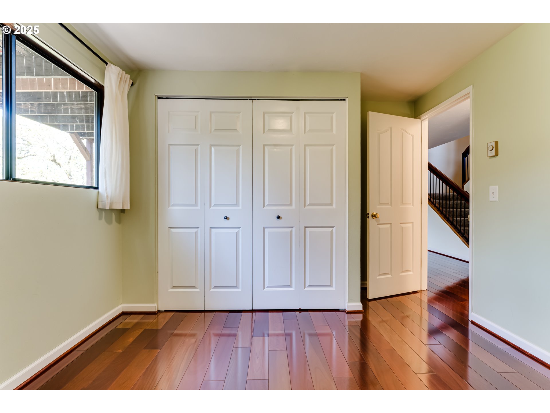 5140 Saratoga Street Eugene, OR 97405 - Photo 34 of 45 a view of an empty room with wooden floor and closet