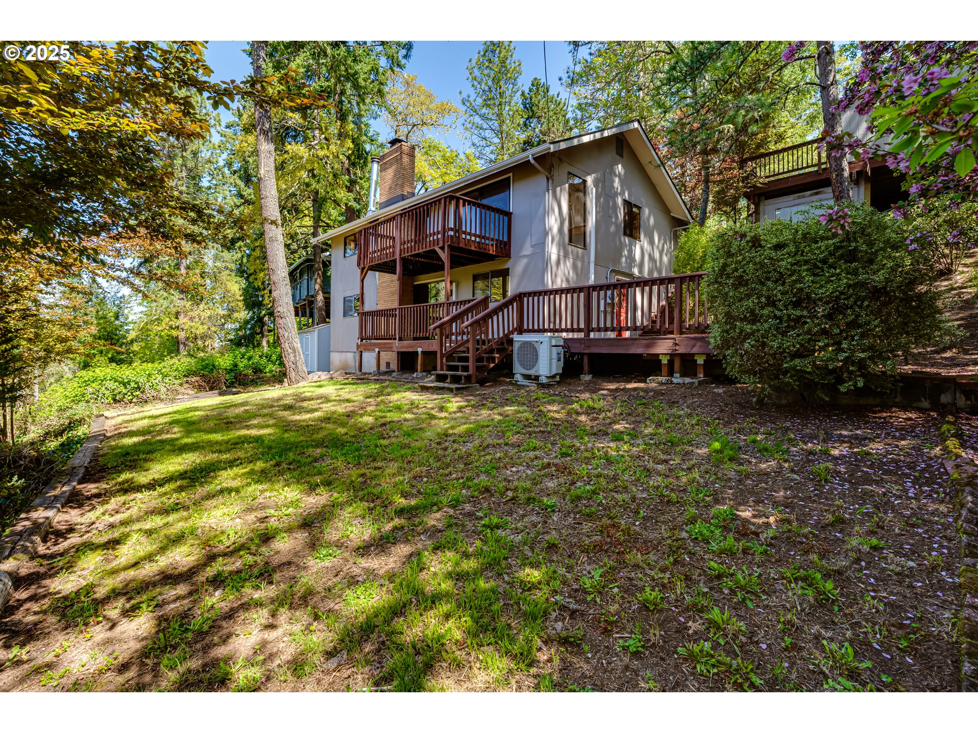 5140 Saratoga Street Eugene, OR 97405 - Photo 45 of 45 a view of a big house with a big yard and large trees