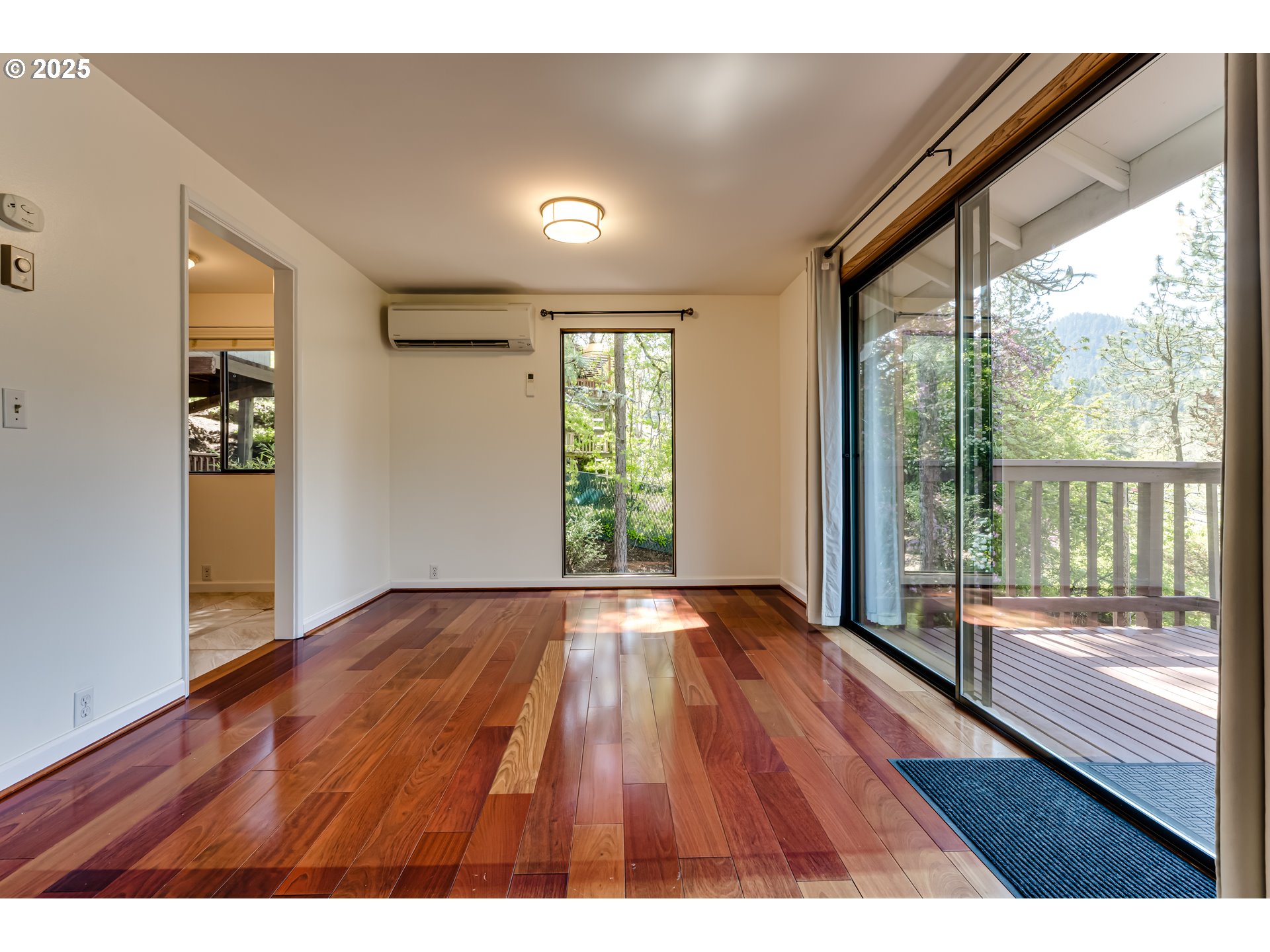 5140 Saratoga Street Eugene, OR 97405 - Photo 8 of 45 a view of an empty room with wooden floor and a window