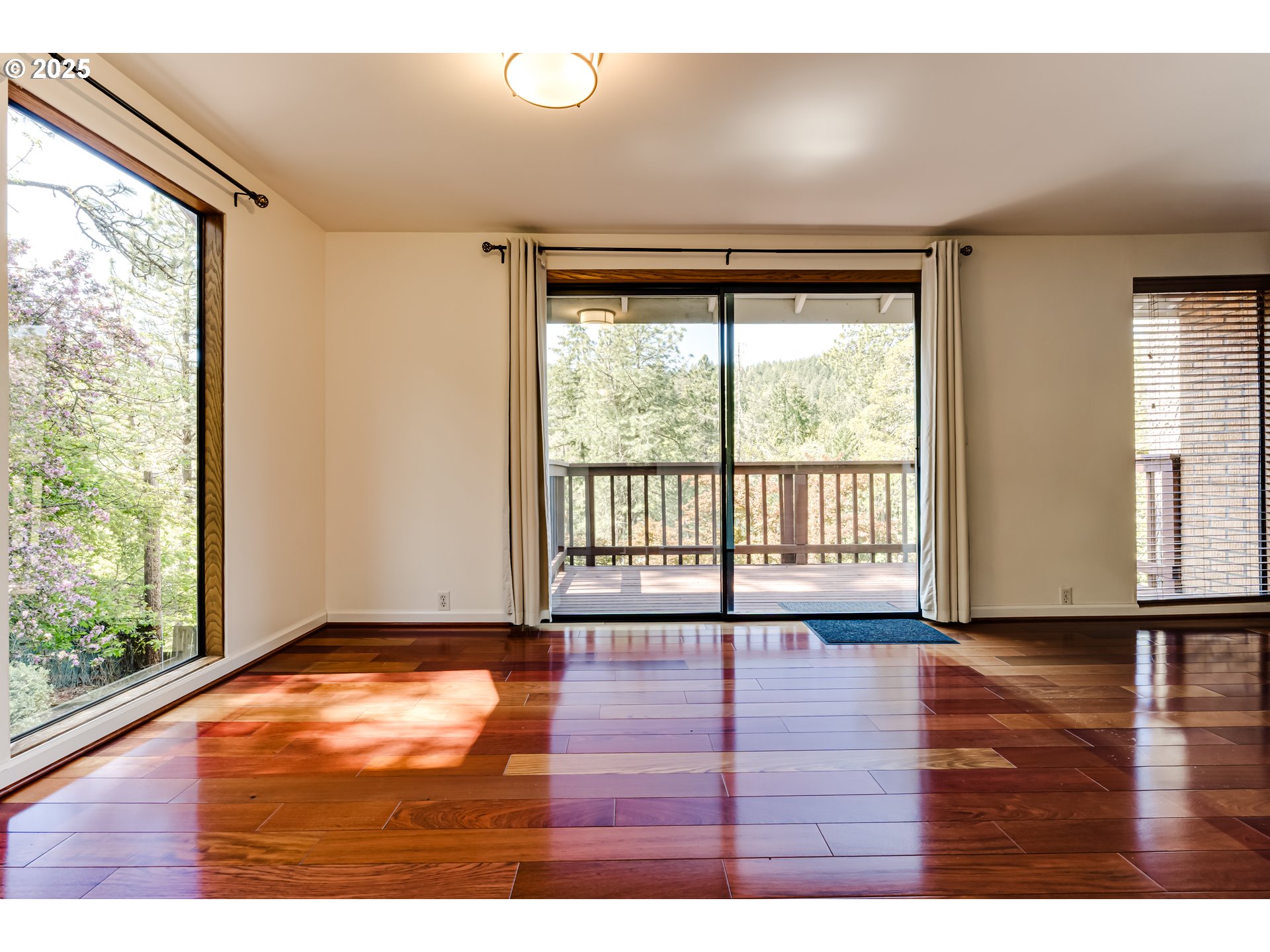5140 Saratoga Street Eugene, OR 97405 - Photo 9 of 45 a view of an empty room with wooden floor and a window