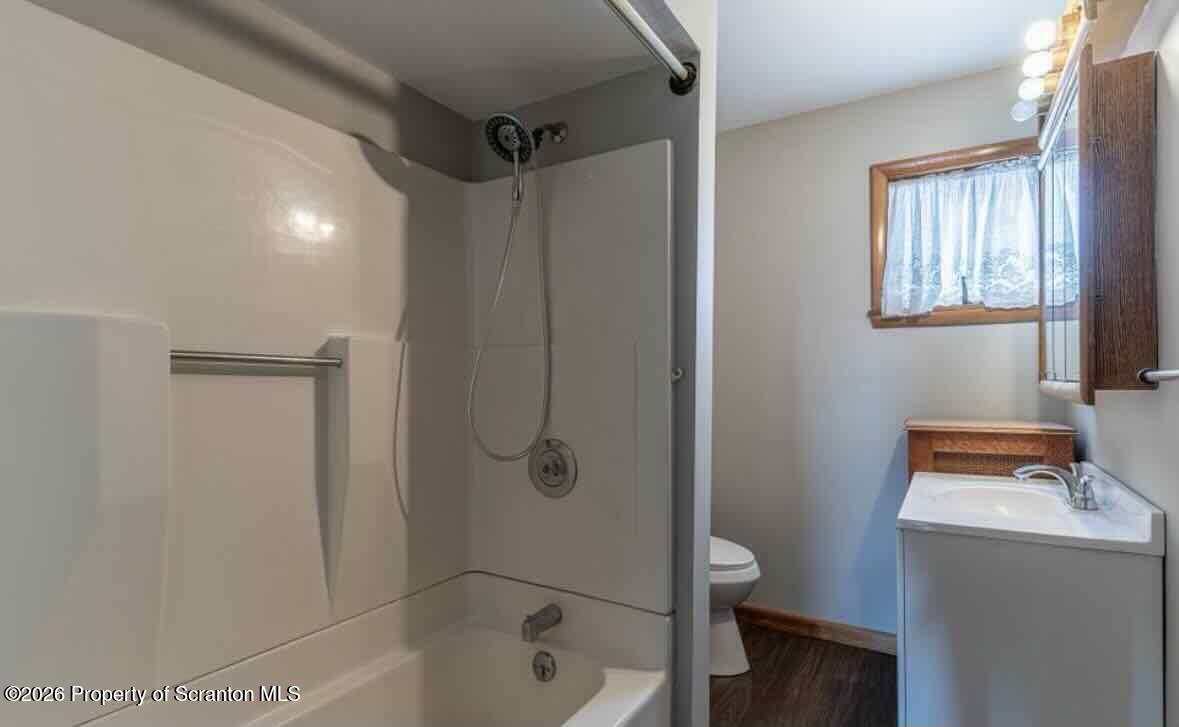 112 East Grove Street Taylor, PA 18517 - Photo 11 of 11 a bathroom with a sink a toilet and shower