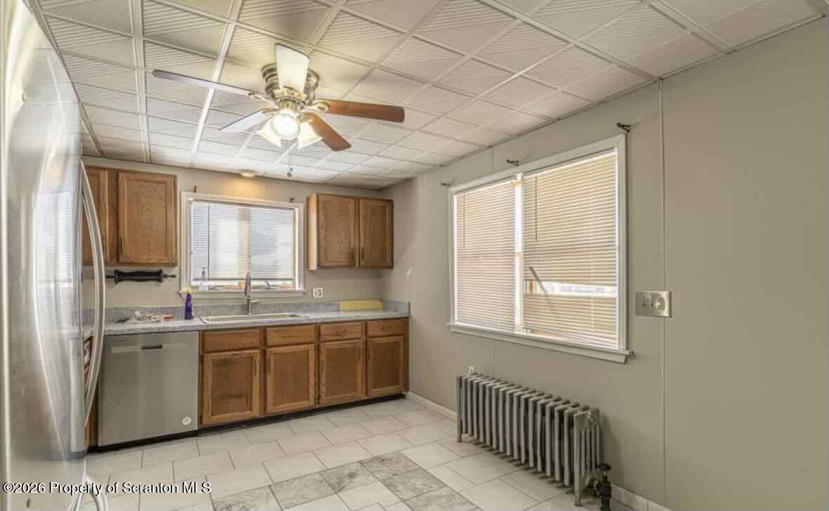 112 East Grove Street Taylor, PA 18517 - Photo 3 of 11 a view of a kitchen and a sink windows