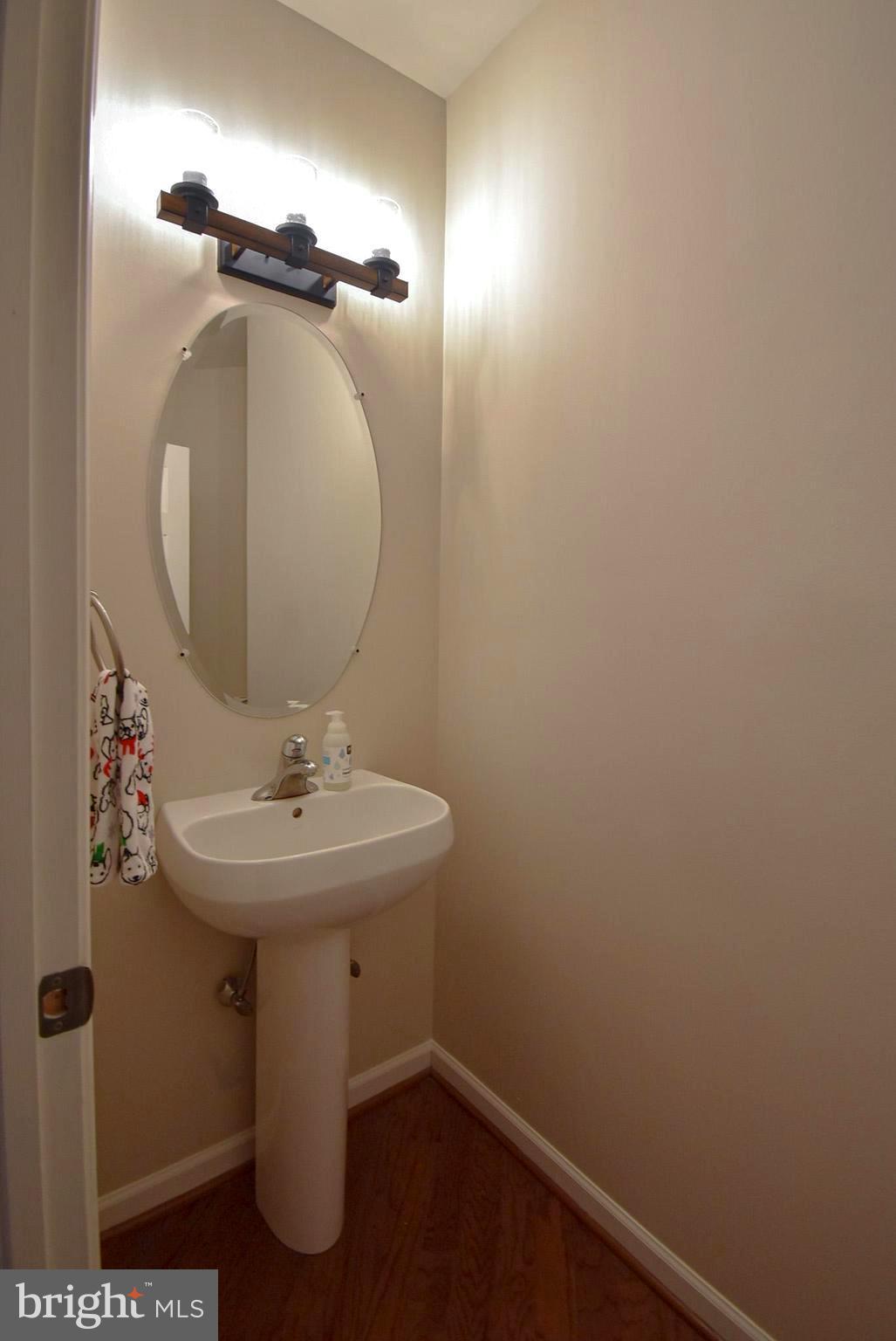 586 Wharton Boulevard Exton, PA 19341 - Photo 12 of 28 a bathroom with a sink and mirror